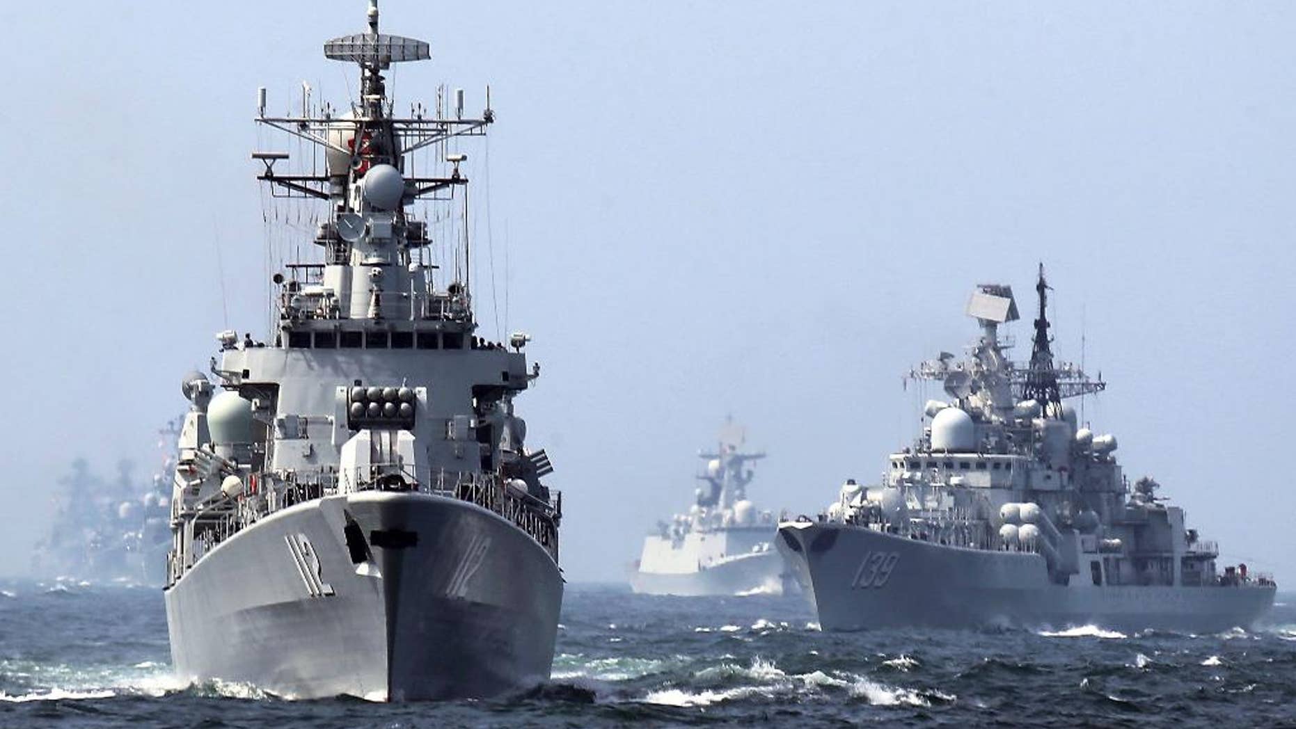 In this May 24, 2014, file photo, China's Harbin (112) guided missile destroyer and DDG-139 Ningbo Sovremenny class Type-956EM destroyer, right, take part in a week-long China-Russia "Joint Sea-2014" navy exercise at the East China Sea off Shanghai, China. A Chinese navy task force wrapped up visits to four Persian Gulf states as the increasingly capable maritime force grows its presence in the strategically vital region. The three ships, including Harbin, departed Kuwait on Sunday, Feb. 5, 2017, after stopping in Saudi Arabia, Qatar and the United Arab Emirates, the Defense Ministry said on its website Monday, Feb. 6, 2017. (Chinatopix via AP)