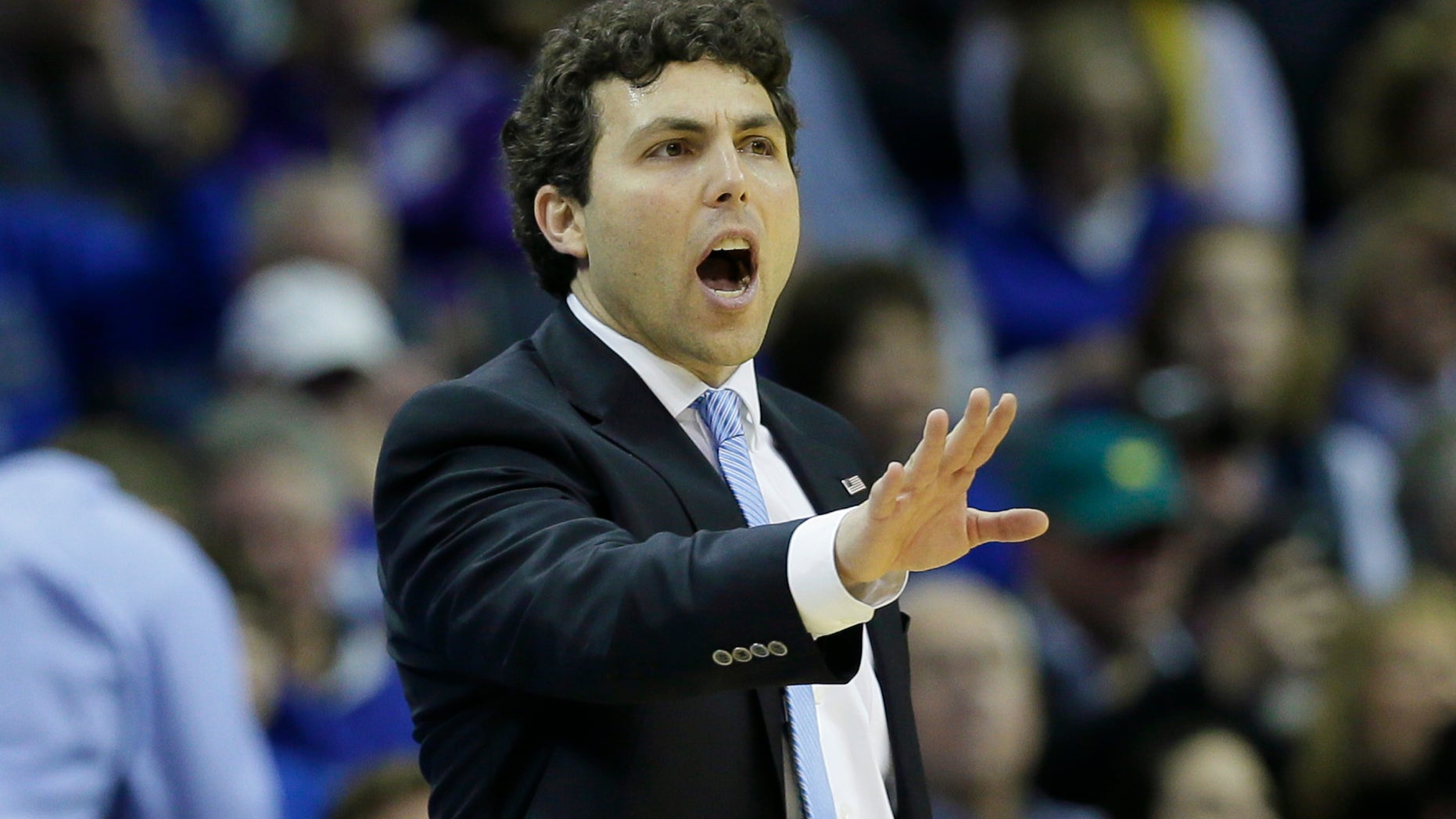 Memphis coach Josh Pastner shouts to players in the second half of an NCAA college basketball game against Central Florida in Memphis, Tenn., Wednesday, Feb. 12, 2014. Memphis defeated UCF 76-70. (AP Photo/Danny Johnston)
