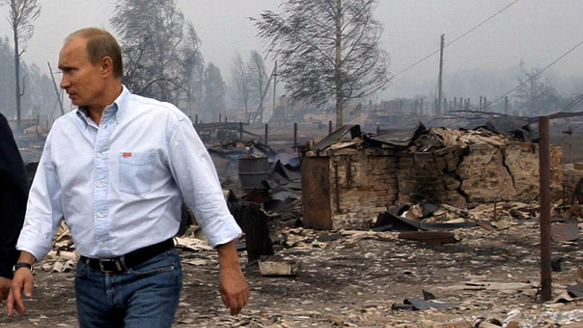 July 30: Russian Prime Minister Vladimir Putin tours the village of Verkhnyaya Vereya, where all 341 houses have burned to the ground.