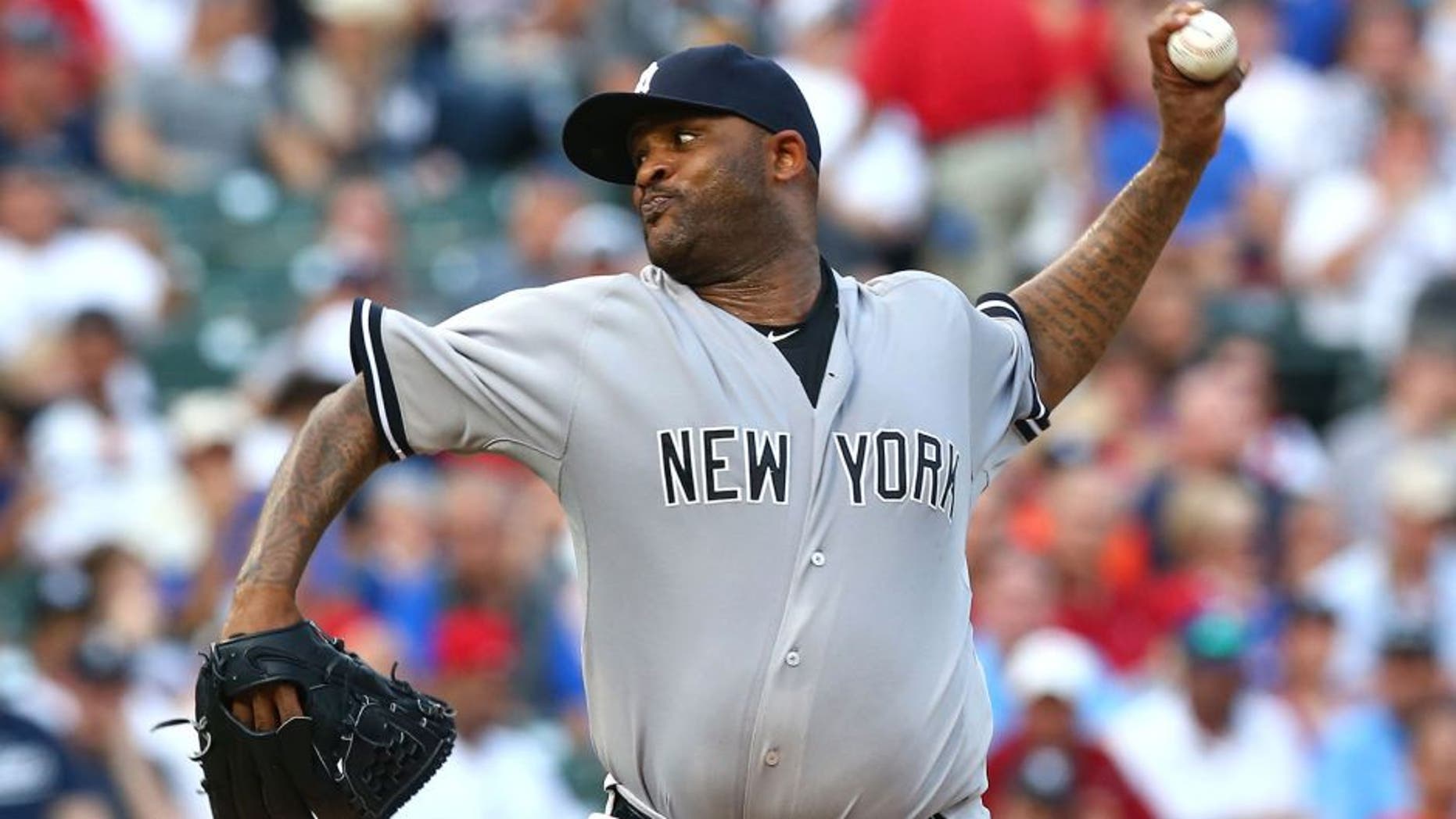 ARLINGTON, TX - JULY 30: CC Sabathia #52 of the New York Yankees throws against the Texas Rangers in the second inning at Globe Life Park in Arlington on July 30, 2015 in Arlington, Texas. (Photo by Ronald Martinez/Getty Images)