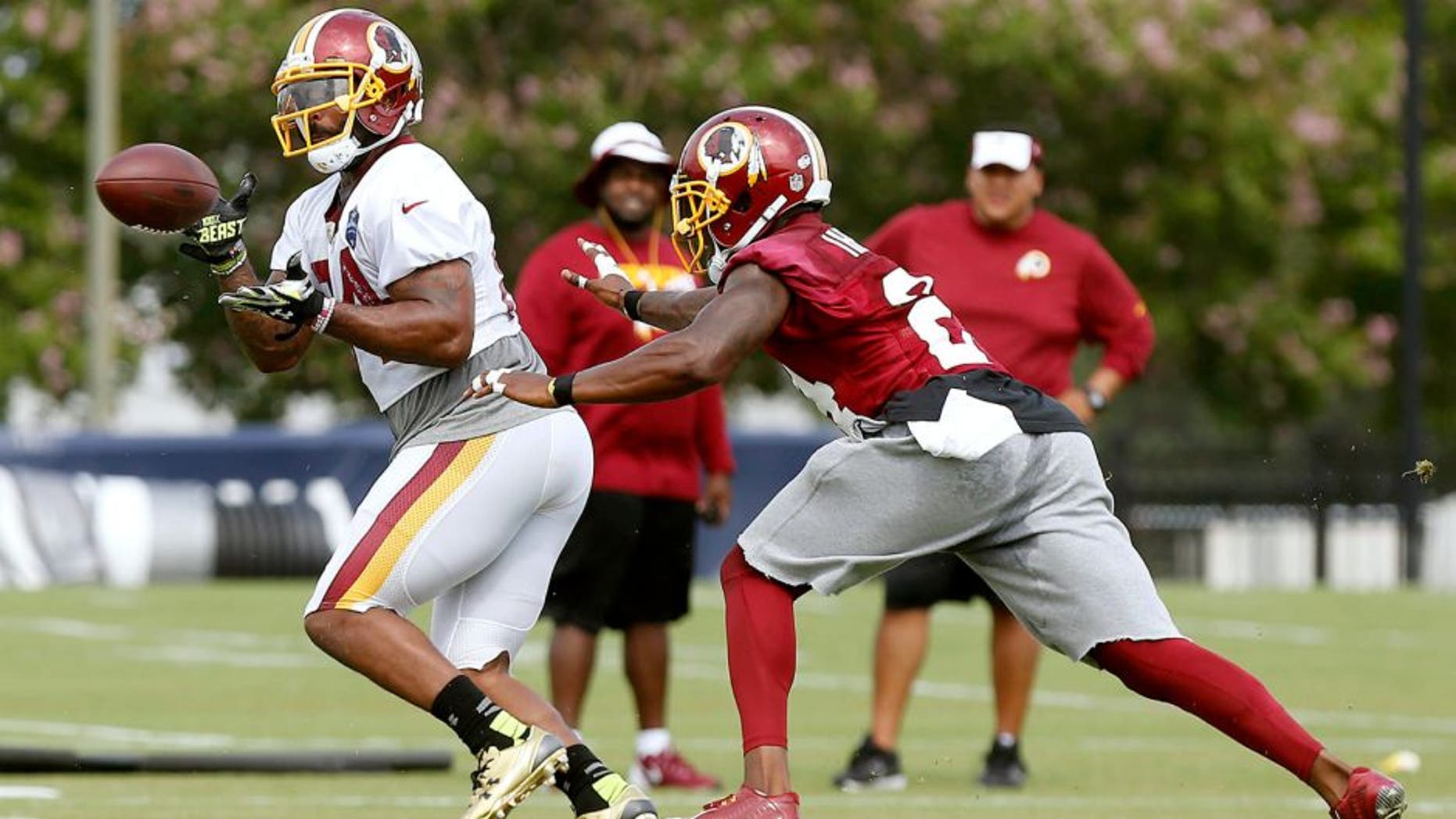 Jul 30, 2015; Richmond, VA, USA; Washington Redskins tight end Niles Paul (84) catches the ball in front of Redskins defensive back Duke Ihenacho (24) during drills as part of afternoon practice on day one of training camp at the Washington Redskins Bon Secours Training Center. Mandatory Credit: Geoff Burke-USA TODAY Sports
