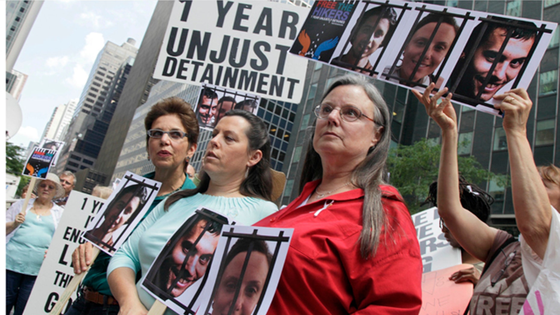 Laura Fattal, left, Cindy Hickey, center, and Nora Shourd, mothers of three American hikers jailed in Iran, participate in a demonstration outside Iran's mission to the United Nations, in New York, Friday, July 30, 2010. Saturday marks a year since the hikers were arrested along the Iraqi border. (AP Photo/Richard Drew)