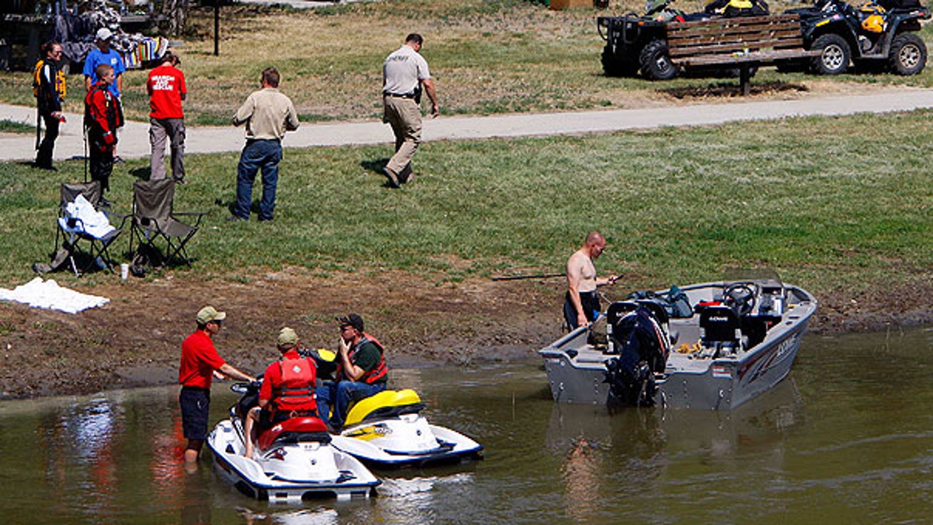 July 29: Rescuers continue to search for Converse County Deputy Bryan Gross, who has been missing since he swam into a swollen eastern Wyoming river to help a struggling girl Thursday evening near Douglas, Wyo.