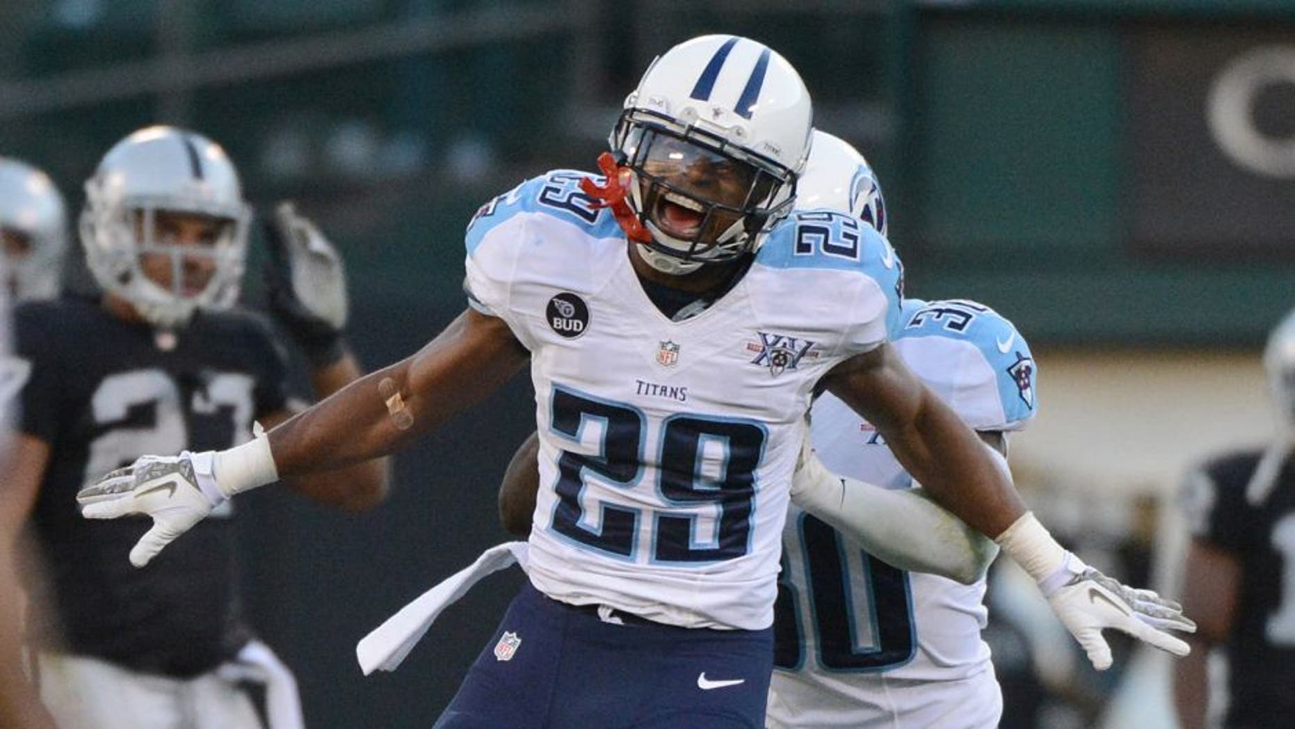 November 24, 2013; Oakland, CA, USA; Tennessee Titans cornerback Blidi Wreh-Wilson (29) celebrates after a defensive stop during the fourth quarter against the Oakland Raiders at O.co Coliseum. The Titans defeated the Raiders 23-19. Mandatory Credit: Kyle Terada-USA TODAY Sports