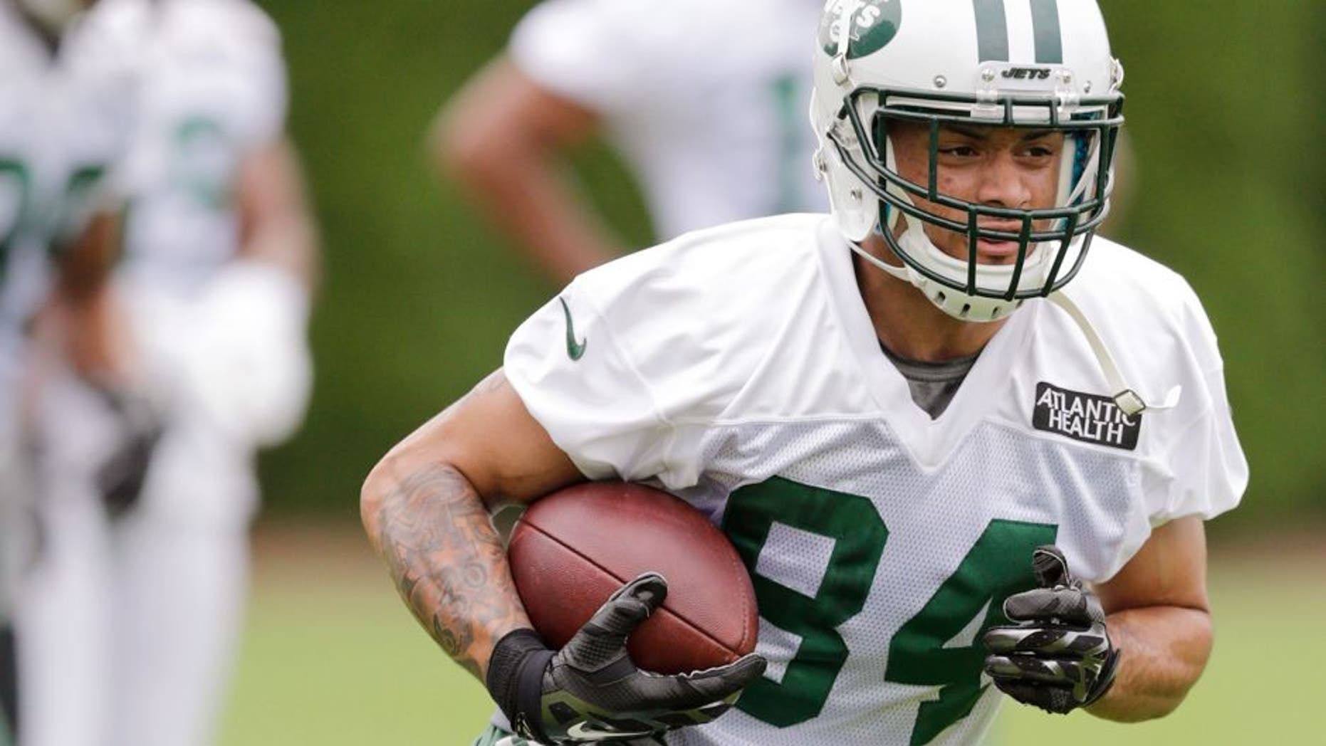 New York Jets wide receiver Devin Smith (84) runs after making a catch at NFL football training camp, Thursday, July 30, 2015, in Florham Park, N.J. (AP Photo/Frank Franklin II)