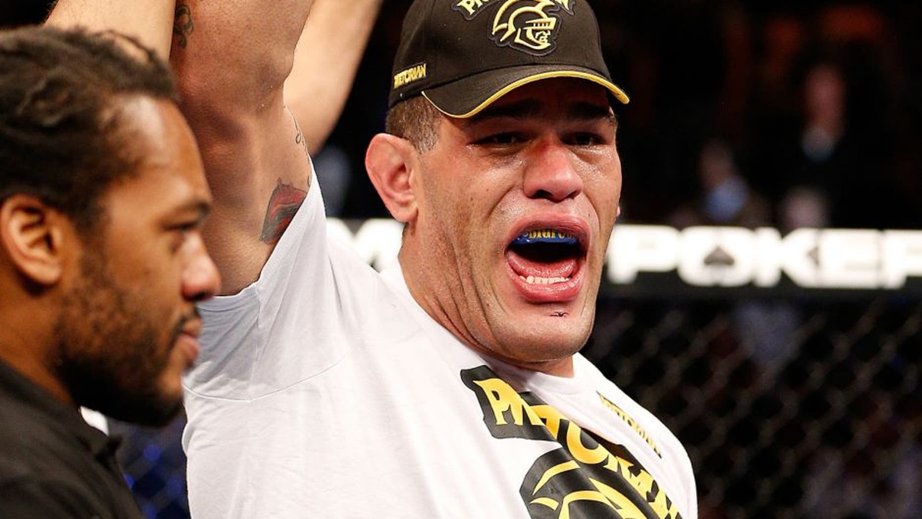 LAS VEGAS, NV - FEBRUARY 02: (R-L) Antonio Silva reacts to his knockout victory over Alistair Overeem after their heavyweight fight at UFC 156 on February 2, 2013 at the Mandalay Bay Events Center in Las Vegas, Nevada. (Photo by Josh Hedges/Zuffa LLC/Zuffa LLC via Getty Images)