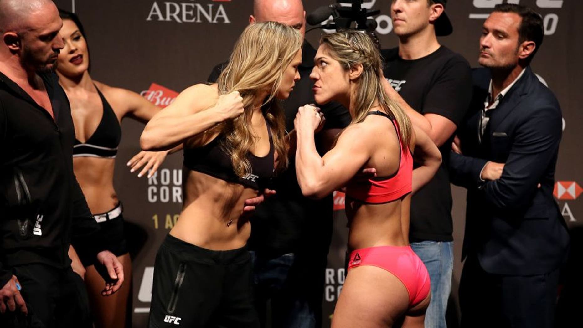 RIO DE JANEIRO, BRAZIL - JULY 31: (L-R) UFC Bantamweight Champion Ronda Rousey of the United States and Bethe Correia of Brazil face off during their UFC 190 weigh-in at HSBC Arena on July 31, 2015 in Rio de Janeiro, Brazil. (Photo by Matthew Stockman/Getty Images)