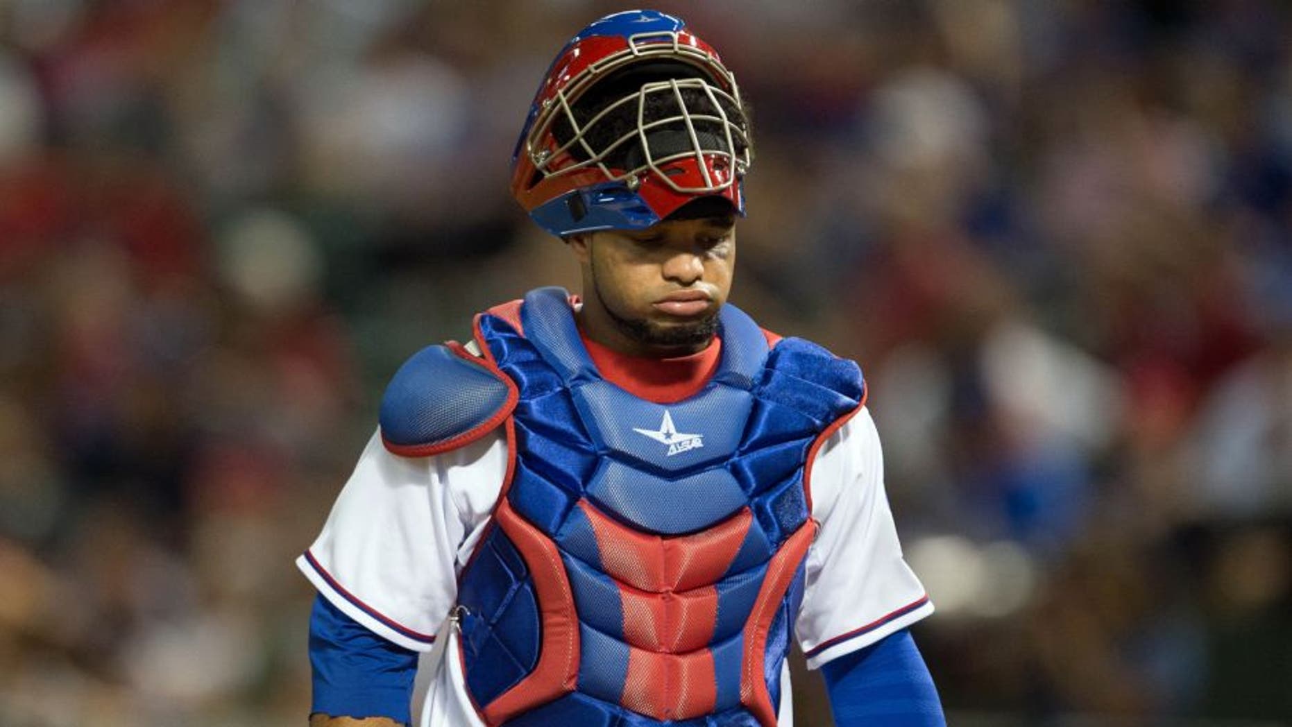 Sep 10, 2014; Arlington, TX, USA; Texas Rangers catcher Tomas Telis (6) reacts to an error by his team during the game against the Los Angeles Angels at Globe Life Park in Arlington. The Angels defeated the Rangers 8-1. Mandatory Credit: Jerome Miron-USA TODAY Sports
