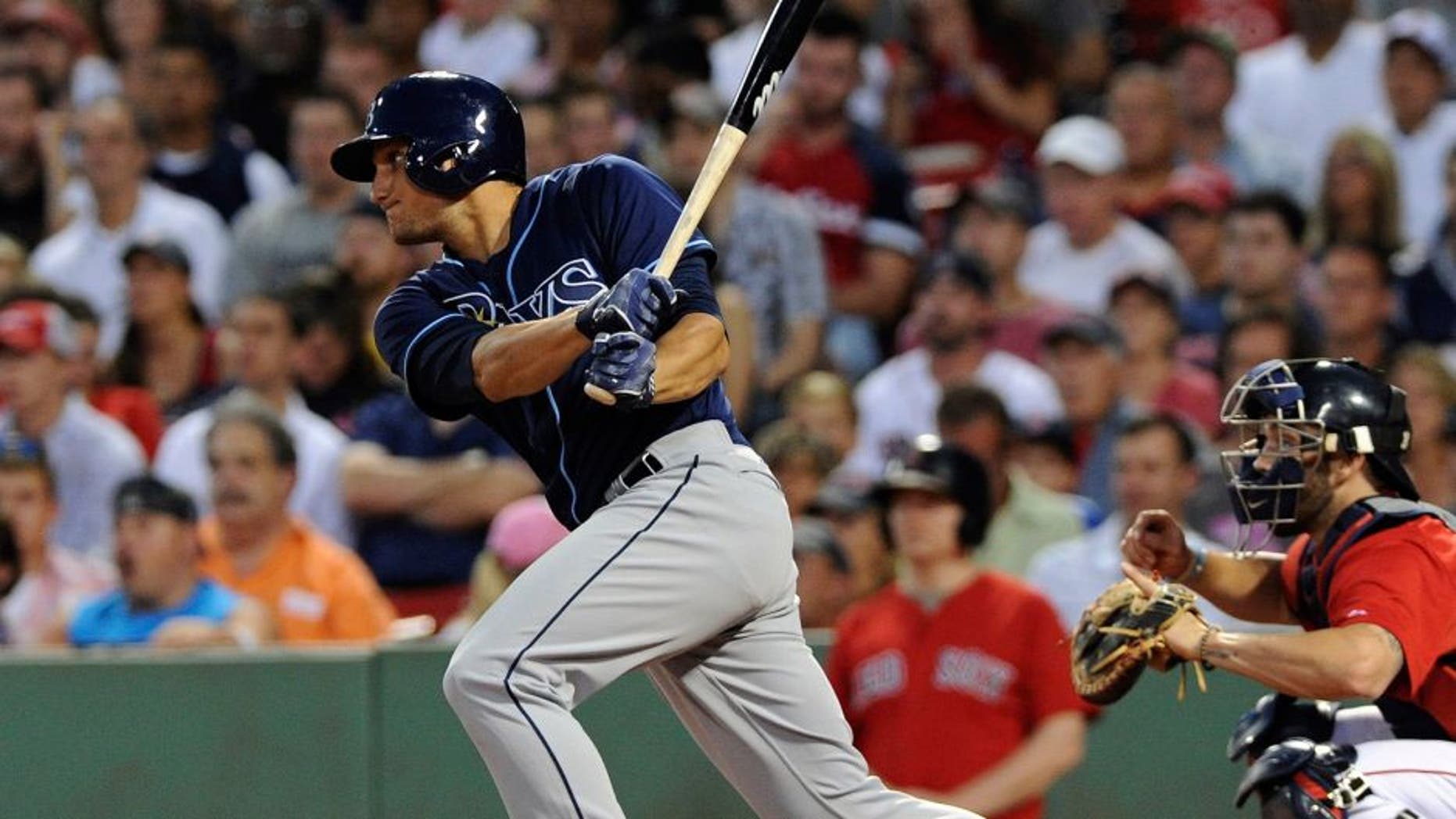 Jul 31, 2015; Boston, MA, USA; Tampa Bay Rays left fielder Mikie Mahtook (27) hits an RBI single during the third inning against the Boston Red Sox at Fenway Park. Mandatory Credit: Bob DeChiara-USA TODAY Sports