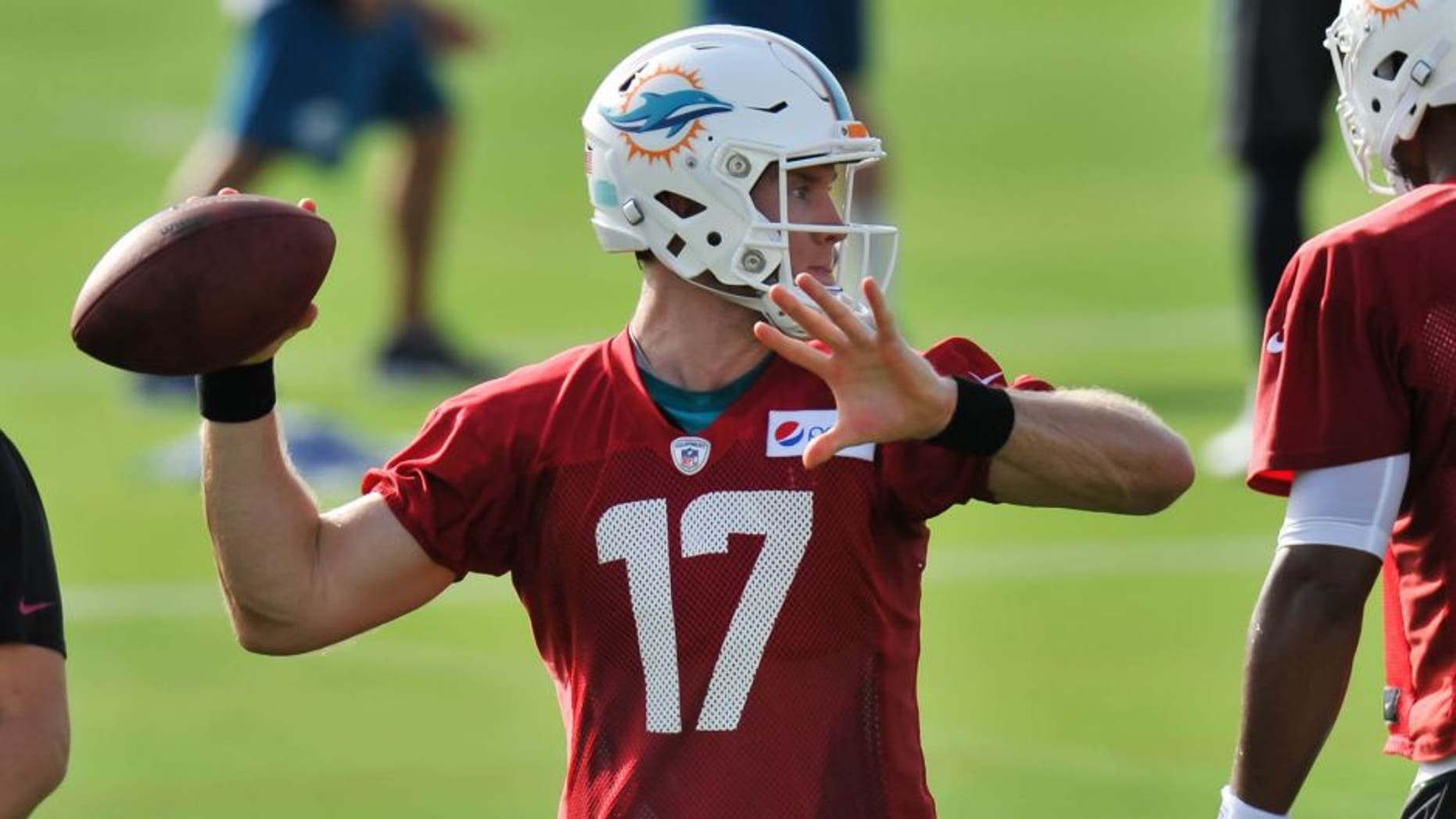 Jul 31, 2015; Davie, FL, USA; Miami Dolphins quarterback Ryan Tannehill (17) during practice drills at Doctors Hospital Training Facility. Mandatory Credit: Steve Mitchell-USA TODAY Sports