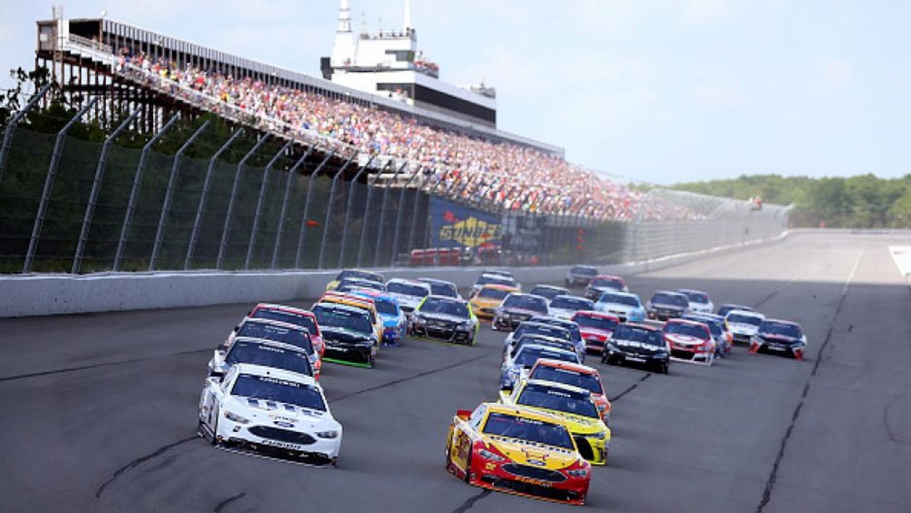 LONG POND, PA - JUNE 06: Brad Keselowski, driver of the #2 Miller Lite Ford, and Joey Logano, driver of the #22 Shell Pennzoil Ford, lead the field into turn one to start the NASCAR Sprint Cup Series Axalta "We Paint Winners" 400 at Pocono Raceway on June 6, 2016 in Long Pond, Pennsylvania. (Photo by Sean Gardner/Getty Images)