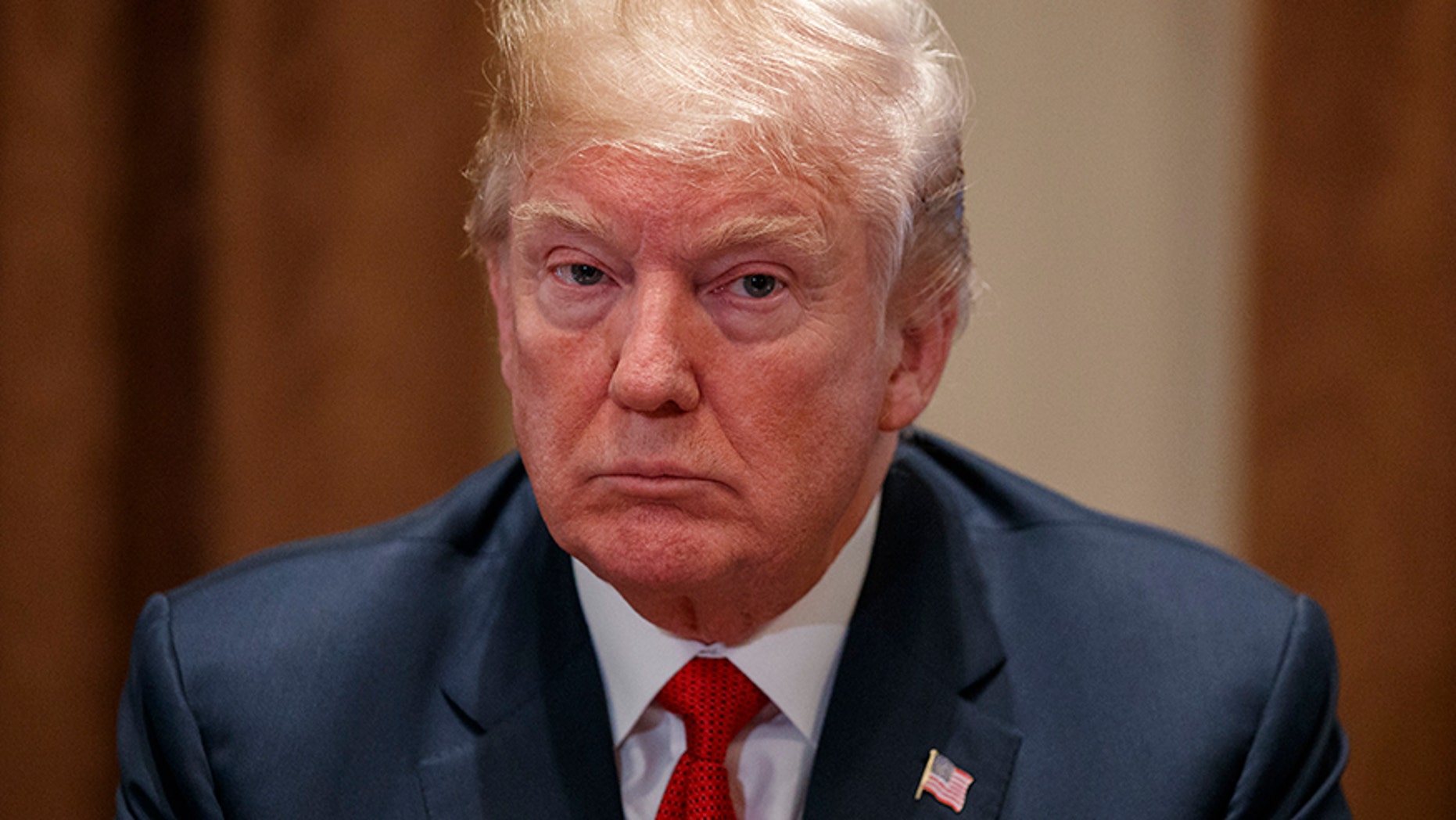 President Donald Trump listens during a meeting with law enforcement officials on the MS-13 street gang and border security, in the Cabinet Room of the White House, Tuesday, Feb. 6, 2018, in Washington. (AP Photo/Evan Vucci)