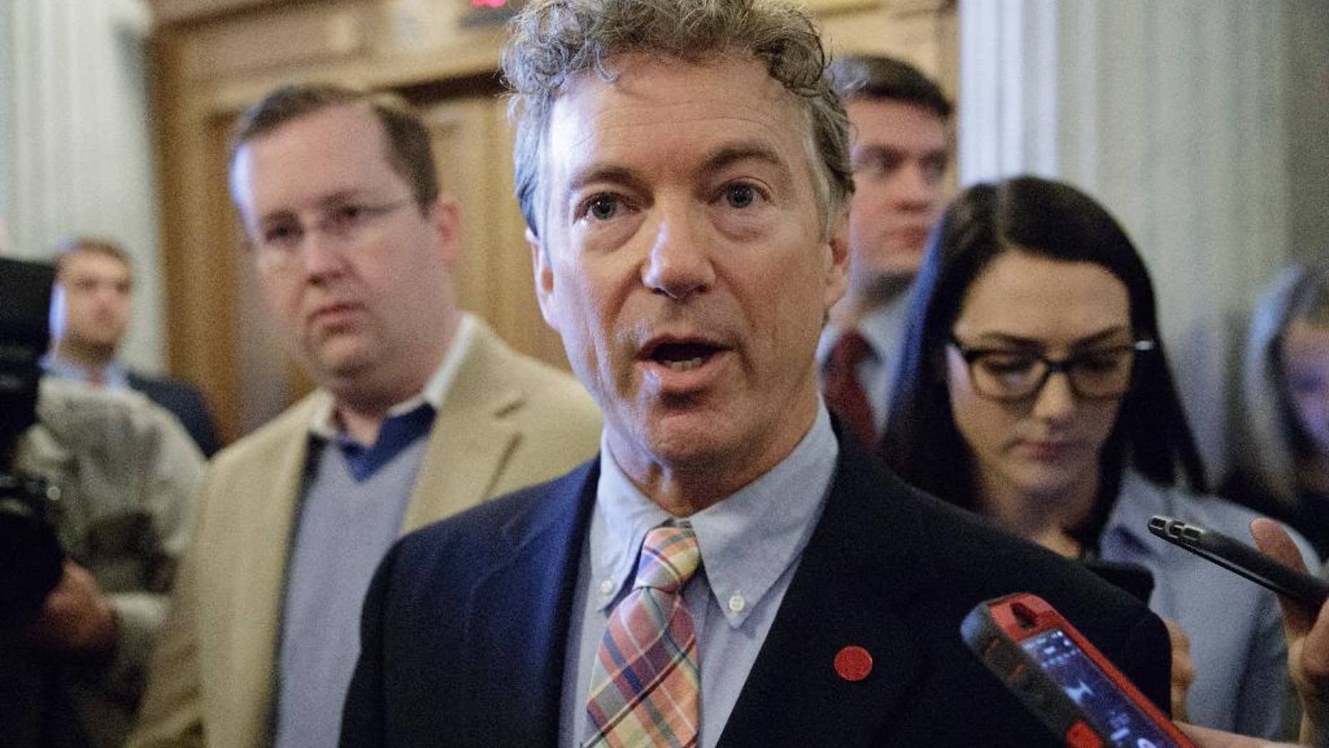 FILE - In this April 7, 2017, file photo, Sen. Rand Paul, R-Ky., speaks to reporters on Capitol Hill in Washington. Paul and Sen. Ron Wyden, D-Ore., are asking the nation’s top intelligence official to release more information about the communications of American citizens swept up in surveillance operations. (AP Photo/J. Scott Applewhite, file)