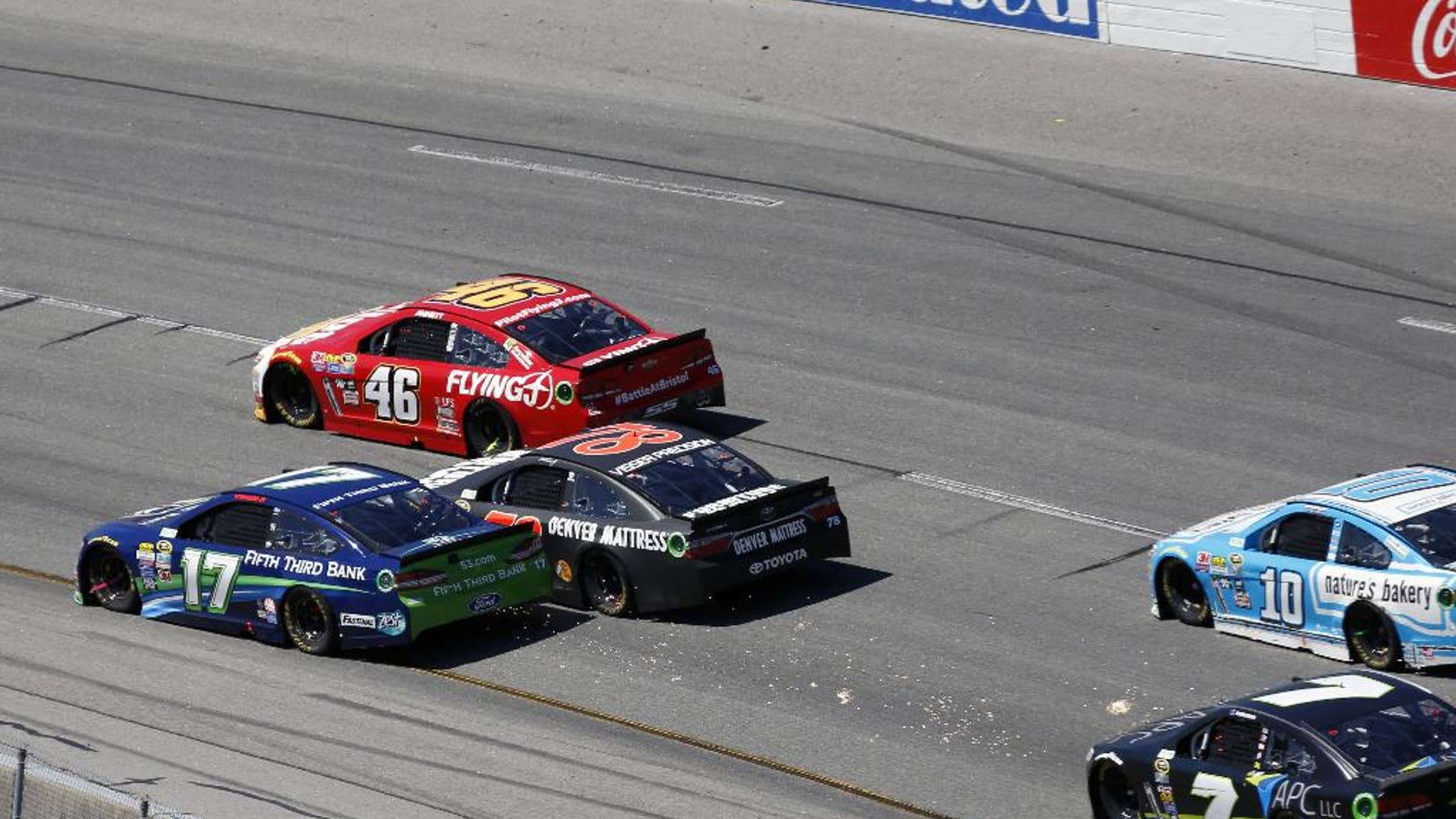Ricky Stenhouse Jr. and Martin Truex Jr. make contact during the Sprint Cup auto race at Richmond International Raceway in Richmond, Va., Sunday, April 24, 2016. (AP Photo/Chet Strange)