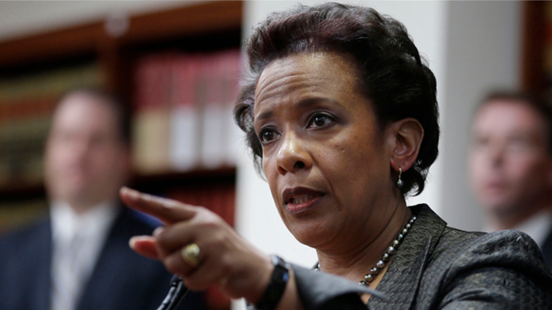 April 28, 2014: Loretta Lynch, U.S. Attorney for the Eastern District of New York, speaks during a news conference in New York. President Obama chose Loretta Lynch as attorney general on Nov. 7, 2014, which would make her the first black woman in the position. (AP/Seth Wenig, File)
