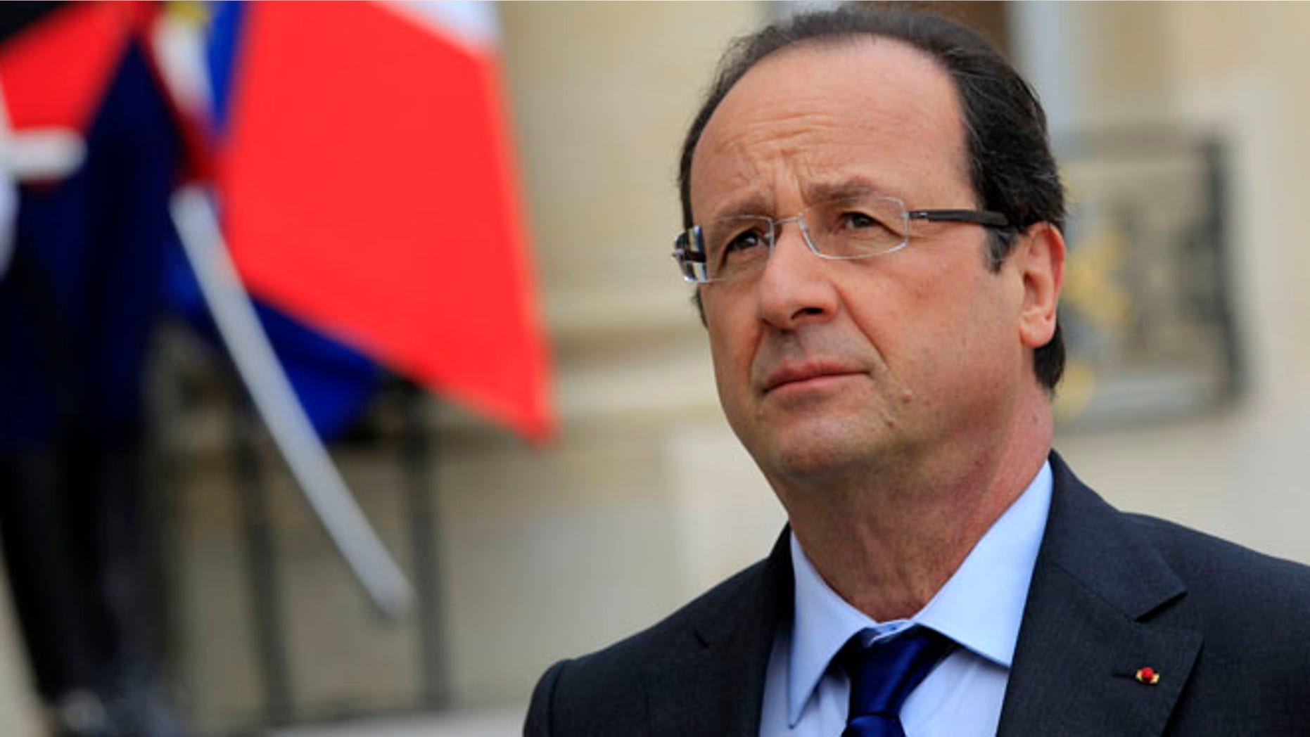 May 17, 2013: French President Francois Hollande reacts as he speaks to journalists in the courtyard after a meeting at the Elysee Palace in Paris.