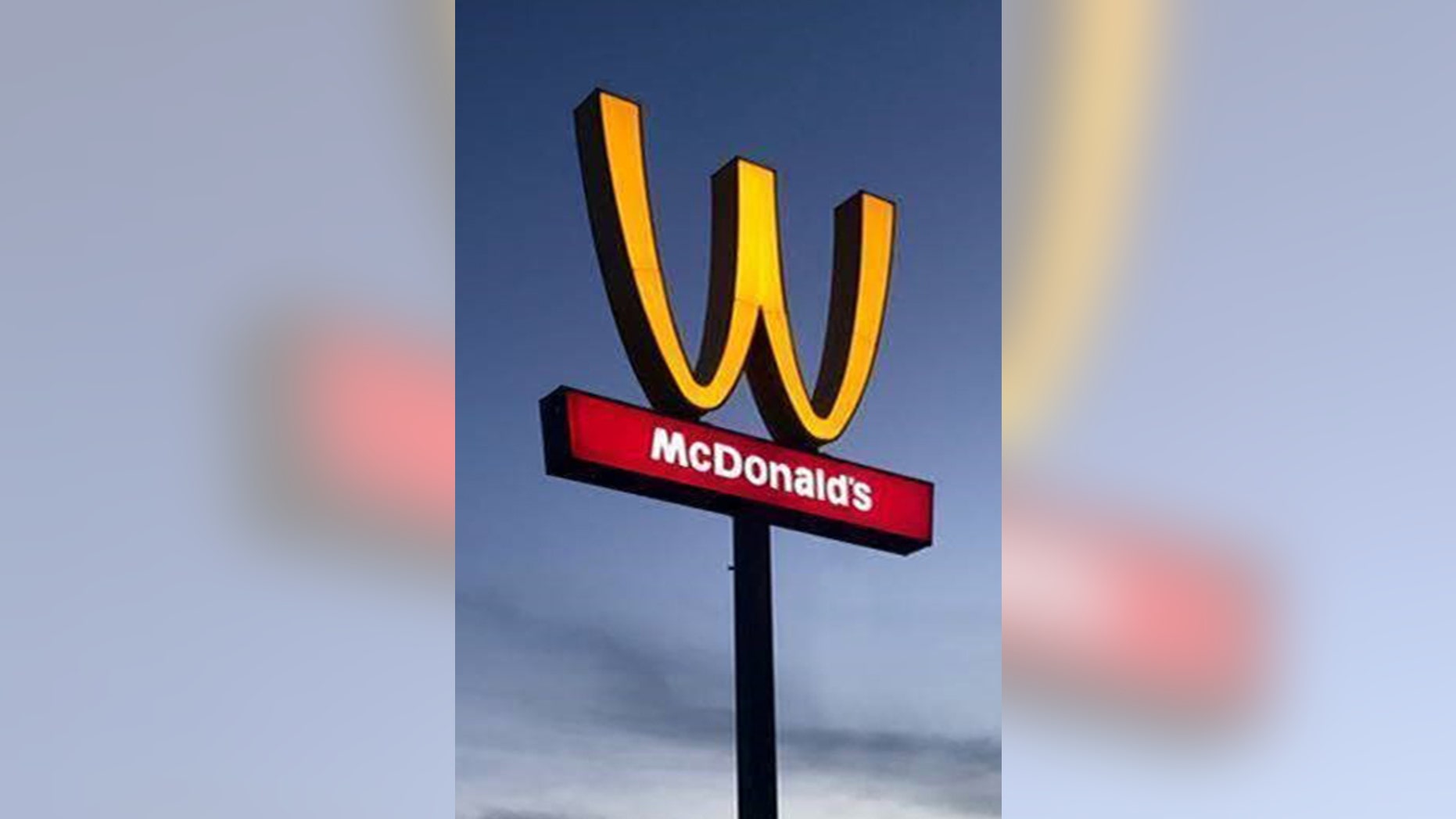 The fast-food chain is drawing mixed reactions for flipping its iconic logo upside down in honor of International Women's Day, March 8.