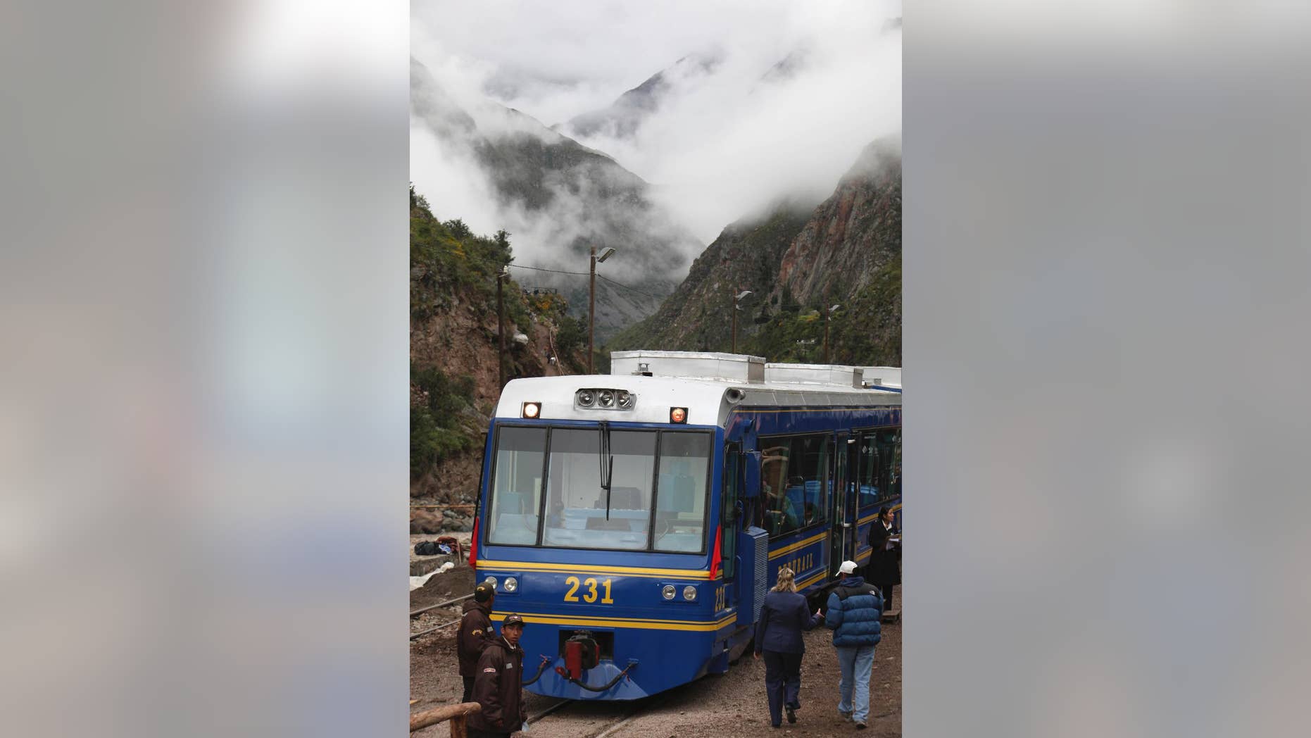 FILE - In this April 1, 2010 file photo, a train waits for passengers at the Piscacucho train station prior to departing toward the citadel of Machu Picchu in Cuzco, Peru. A local protest has temporarily suspended the train service on Tuesday, Nov. 15, 2016 that takes tourists to the ancient Incan citadel of Machu Picchu, the most visited place in Peru. (AP Photo/Karel Navarro, File)