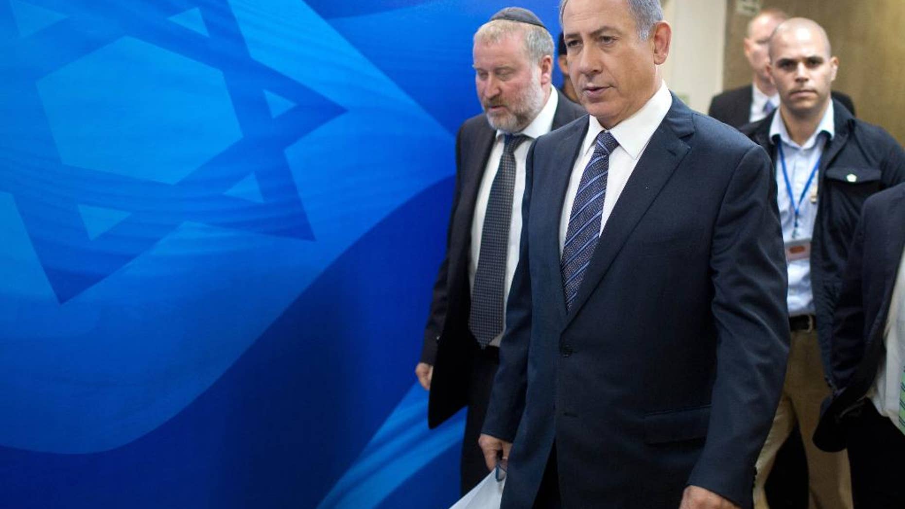 Israeli Prime Minister Benjamin Netanyahu, second left, and Cabinet Secretary, Avichai Mandelblit, left, arrive for the the weekly cabinet meeting at the prime minister's office in Jerusalem, Sunday, Sept. 6, 2015. (Menahem Kahana/Pool photo via AP)