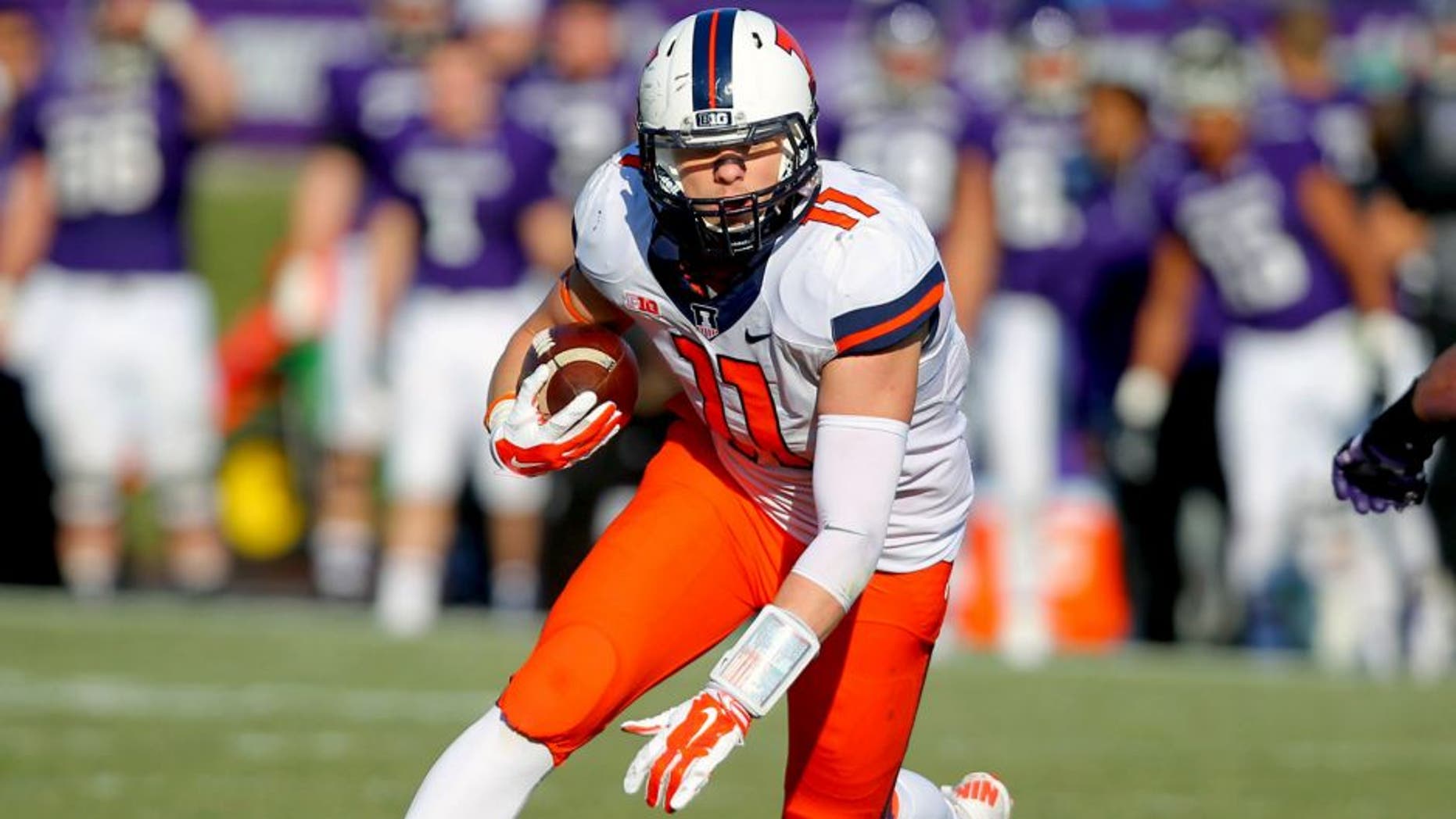 Nov 29, 2014; Evanston, IL, USA; Illinois Fighting Illini tight end Matt LaCosse (11) with the ball during the second half against the Northwestern Wildcats at Ryan Field. Illinois won 47-33. Mandatory Credit: Dennis Wierzbicki-USA TODAY Sports