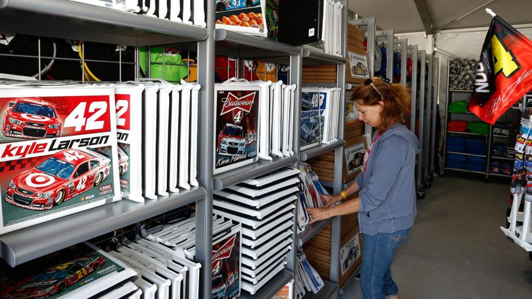 LONG POND, PA - JULY 31: Fans shop in the NASCAR Trackside Superstore ahead of practice for the NASCAR Sprint Cup Series Windows 10 400 at Pocono Raceway on July 31, 2015 in Long Pond, Pennsylvania. (Photo by Jeff Zelevansky/NASCAR via Getty Images)