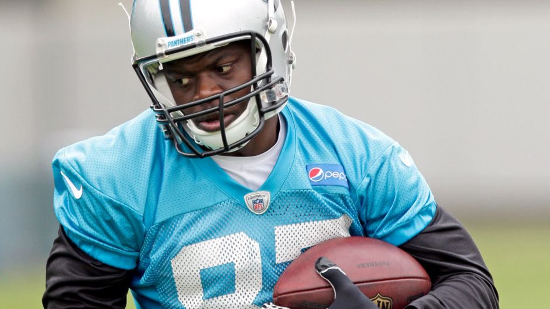 In this June 4, 2015, photo Carolina Panthers' Stephen Hill runs after a catch during an NFL football organized team activity in Charlotte, N.C. Hill has been cited for knowingly possessing drug paraphernalia with intent to use. Concord Police Department records indicate Hill was cited Tuesday near Charlotte Motor Speedway for possessing two grinders with marijuana residue and a marijuana bowl used to process, prepare and store. Panthers players are scheduled to arrive for training camp on Thursday. (AP Photo/Chuck Burton)