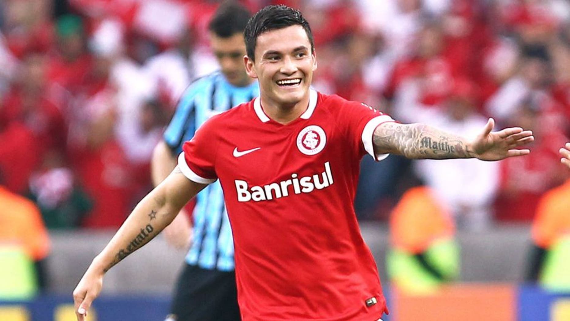 PORTO ALEGRE, BRAZIL - AUGUST 10: Charles Aranguiz, of Internacional celebrates their first goal during the match between Internacional and Gremio as part of Brasileirao Series A 2014, at Estadio Beira-Rio on August 10, 2014, in Porto Alegre, Brazil. (Photo by Lucas Uebel/Getty Images)