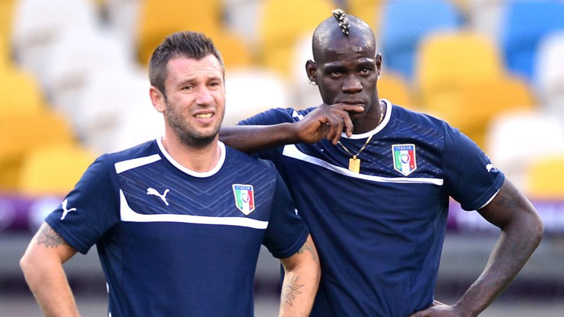 Italians forwards Antonio Cassano (L) and Mario Balotelli take part in a training session on June 30, 2012 at the Olympic Stadium in Kiev, on the eve of the team's Euro 2012 football championships final match. AFP PHOTO / GABRIEL BOUYS (Photo credit should read GABRIEL BOUYS/AFP/GettyImages)