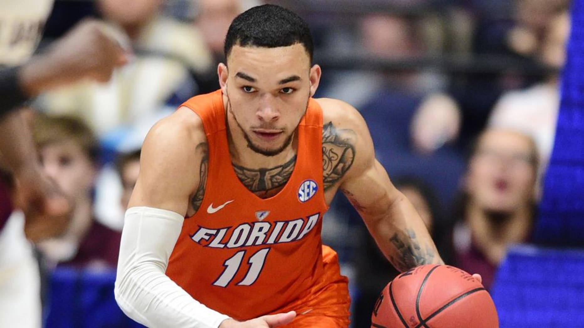 Mar 11, 2016; Nashville, TN, USA; Florida Gators guard Chris Chiozza (11) dribbles the ball up the floor in the second half of the SEC conference tournament against the Texas A&M Aggies at Bridgestone Arena. Texas A&M Aggies won 72-66. Mandatory Credit: Christopher Hanewinckel-USA TODAY Sports