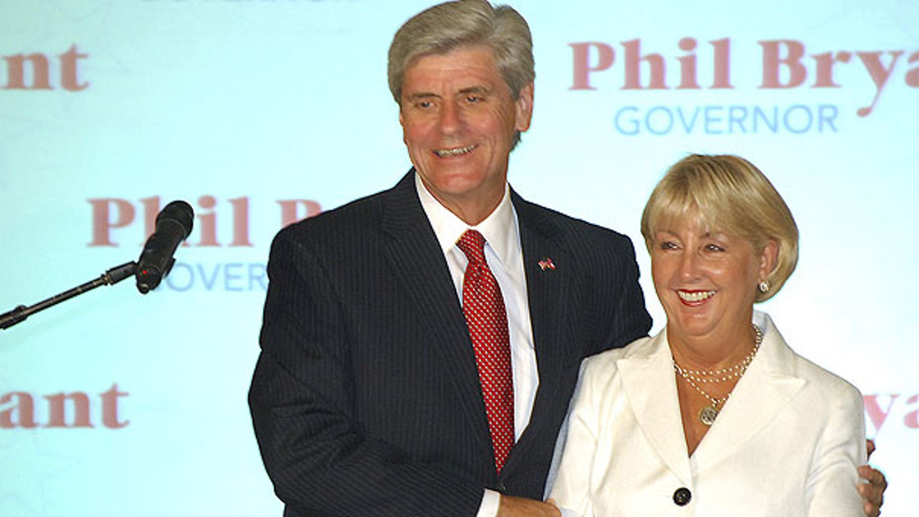 Aug. 2: Gubernatorial candidate Phil Bryant holds wife, Debra, as he greets supporters after being declared the winner of the Republican primary at the Old Capitol Inn in downtown Jackson, Miss.