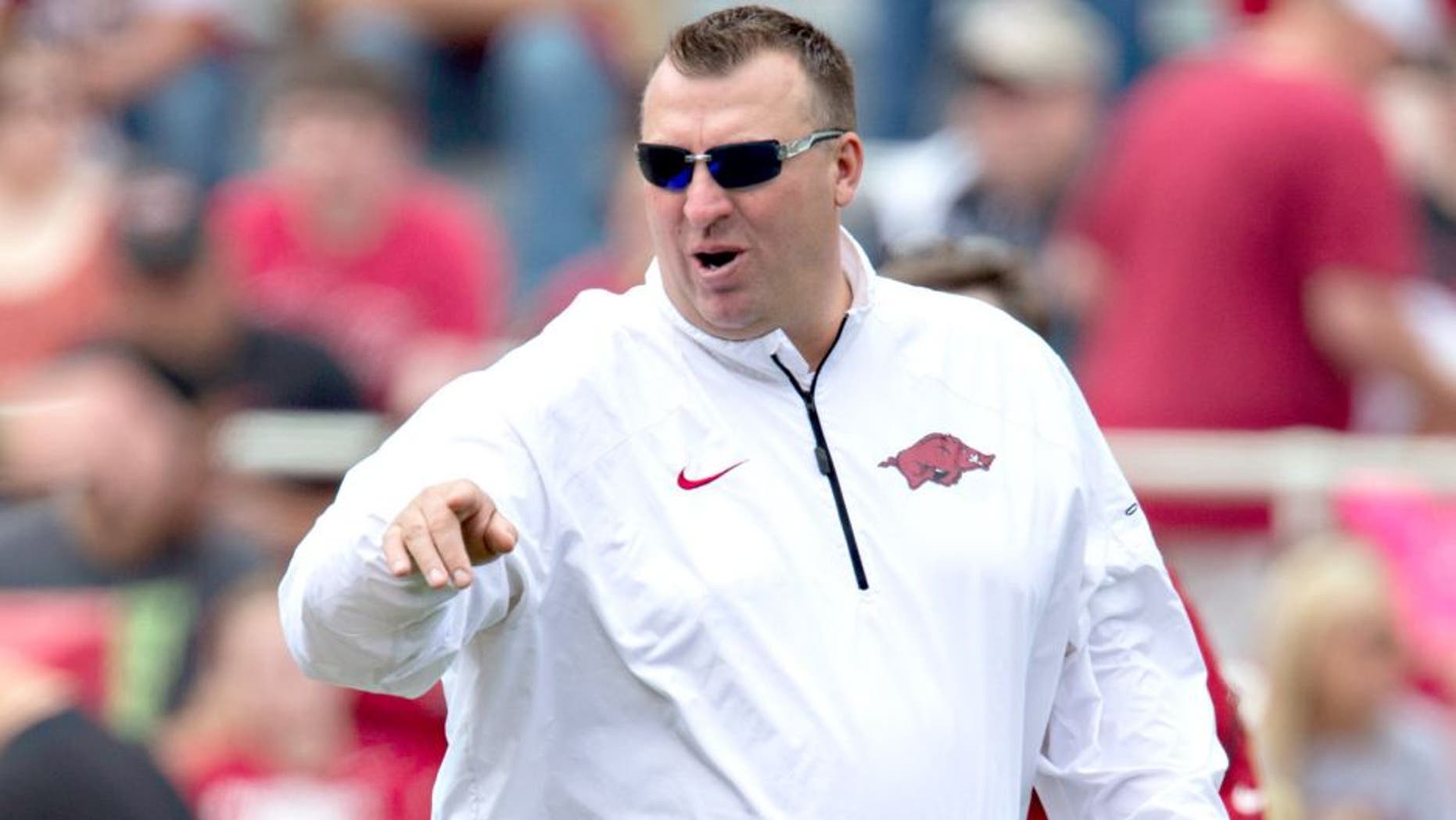 FAYETTEVILLE, ARKANSAS - APRIL 26: Head Coach Bret Bielema of the Arkansas Razorbacks watches his team warm up before the Red White Spring Football game at Razorback Stadium on April 26, 2014 in Fayetteville, Arkansas. (Photo by Wesley Hitt/Getty Images)