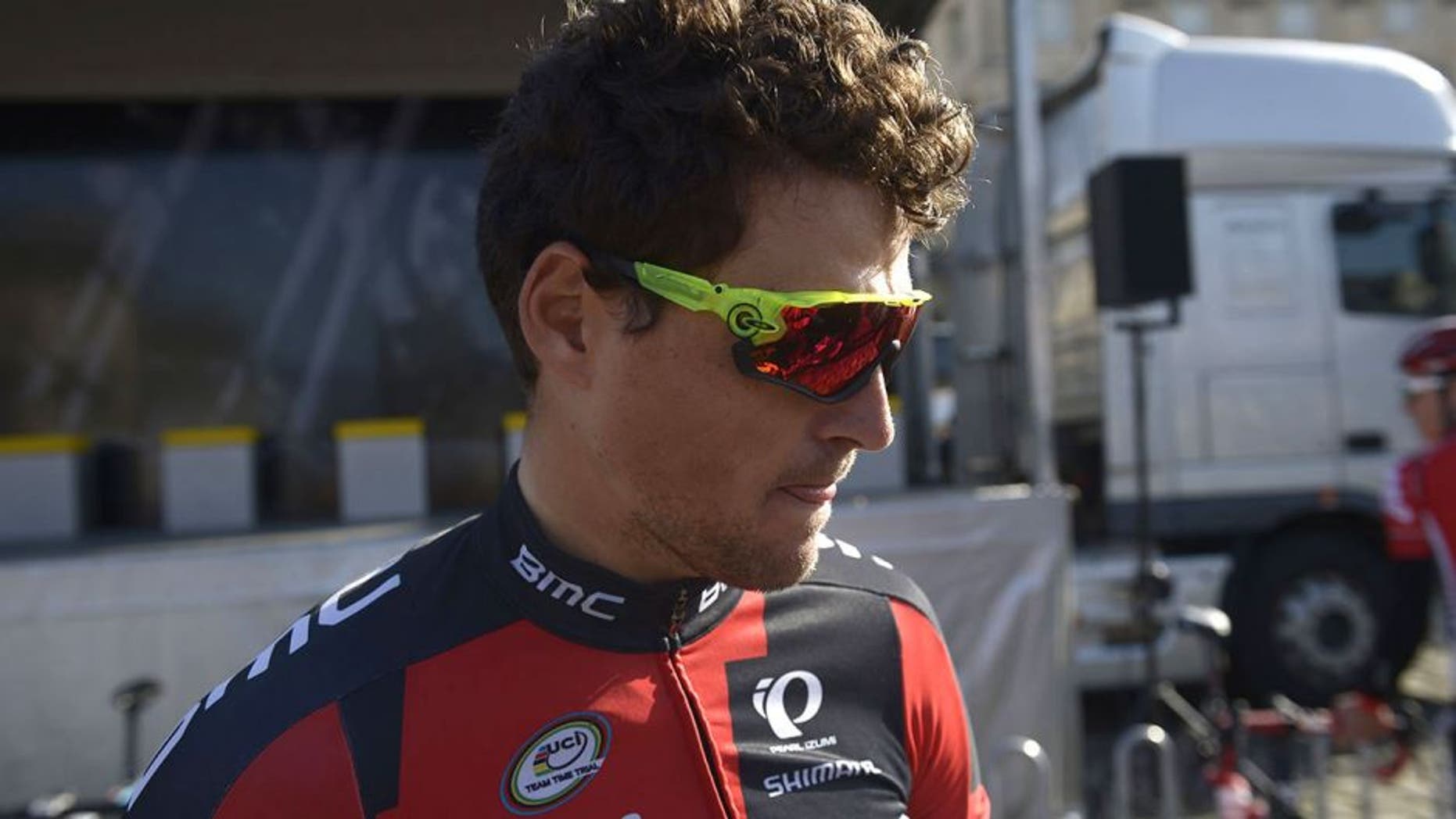 Belgian cyclist Greg Van Avermaet waits along with other competitors in the 113th edition of the Paris-Roubaix Paris-Roubaix one-day classic cycling race assemble at the starting point in Compiègne on April 12, 2015. AFP PHOTO / LIONEL BONAVENTURE (Photo credit should read LIONEL BONAVENTURE/AFP/Getty Images)