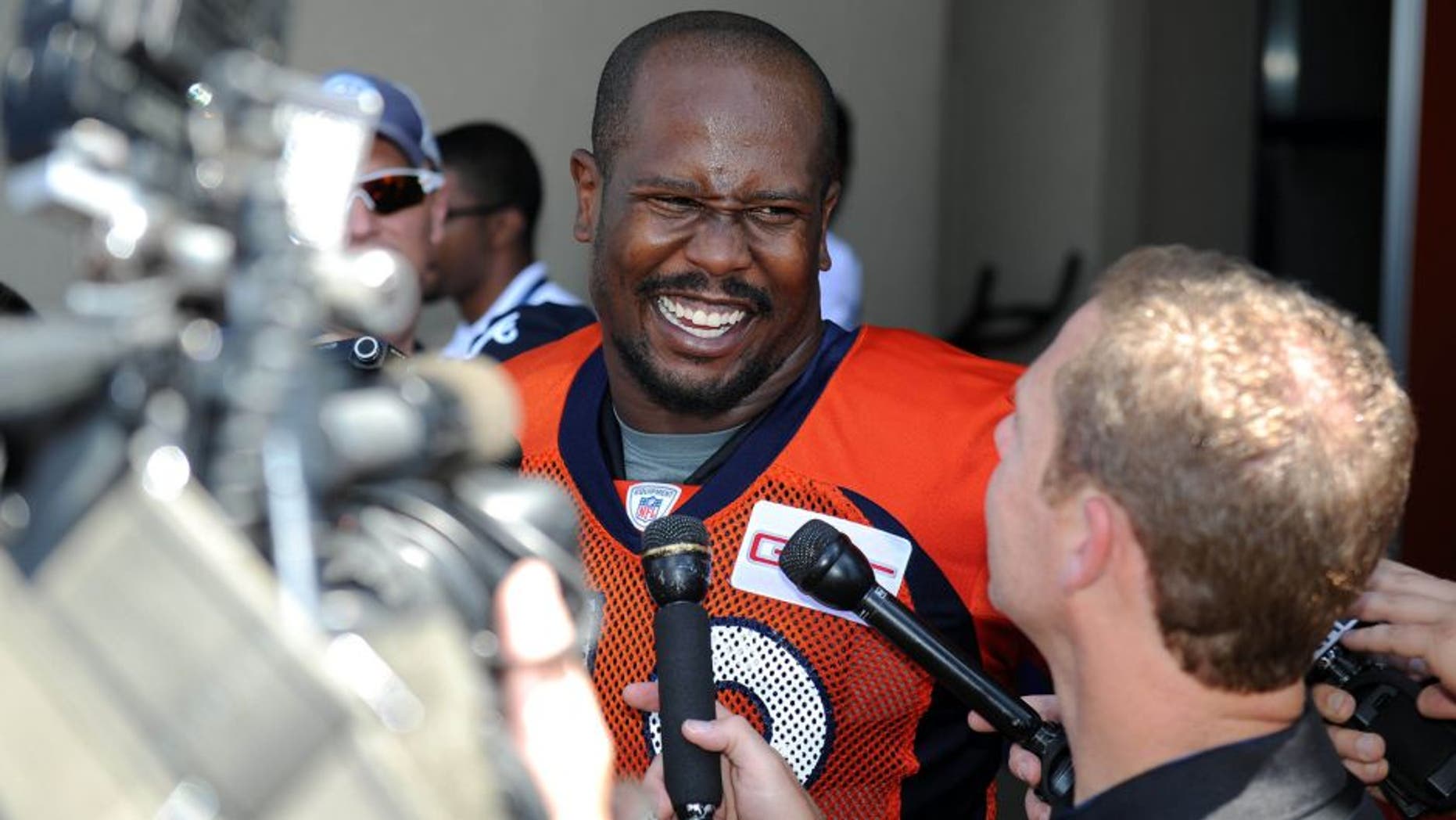 Jul 31, 2015; Englewood, CO, USA; Denver Broncos outside linebacker Von Miller (58) speaks to the media following training camp activities at the UCHealth Training Center. Mandatory Credit: Ron Chenoy-USA TODAY Sports