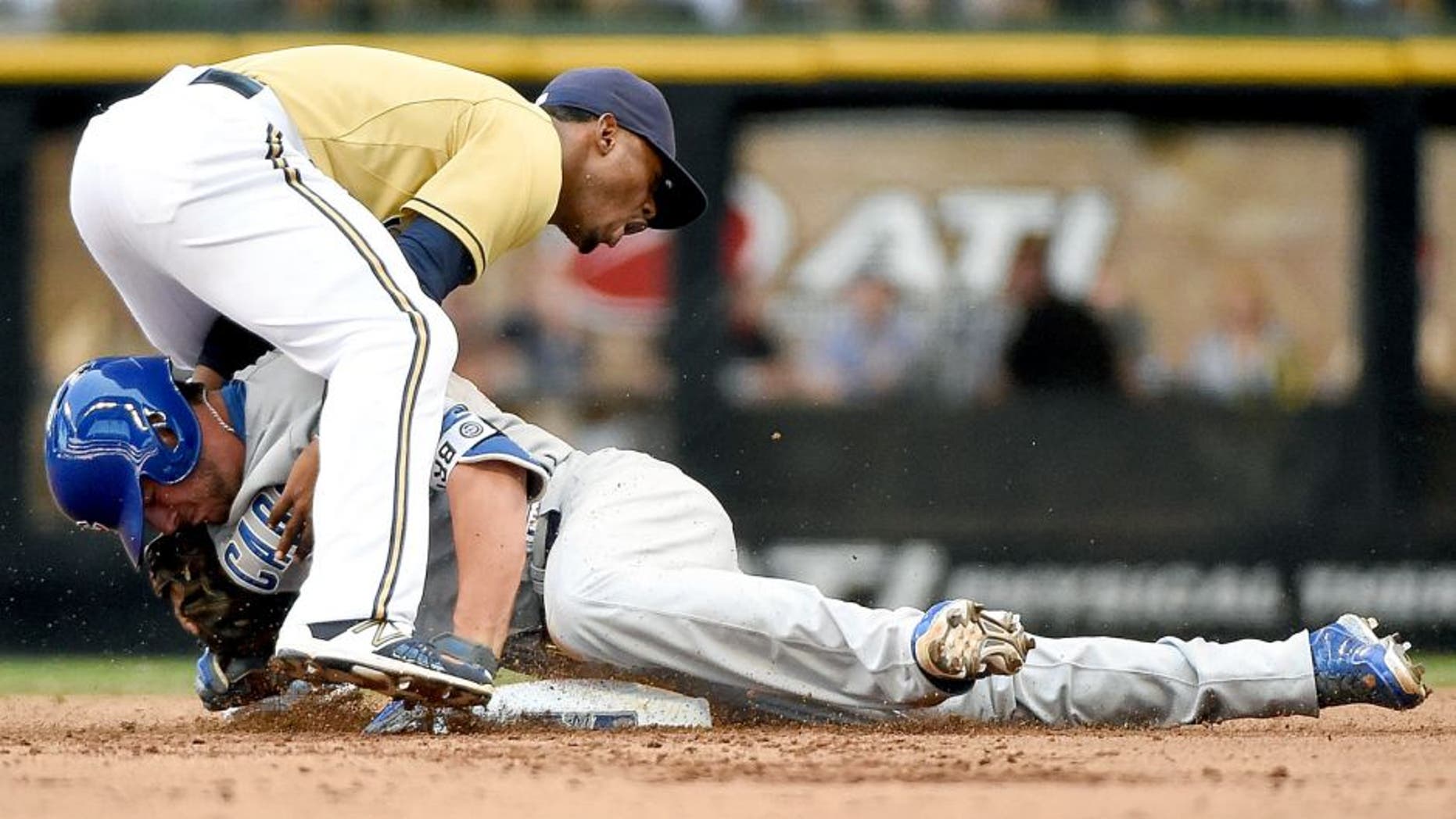Aug 2, 2015; Milwaukee, WI, USA; Chicago Cubs third baseman Kris Bryant (17) slides safely into 2nd base before tag by Milwaukee Brewers shortstop Jean Segura (9) in the fifth inning at Miller Park. Bryant was injured on the play and had to leave the game. Mandatory Credit: Benny Sieu-USA TODAY Sports