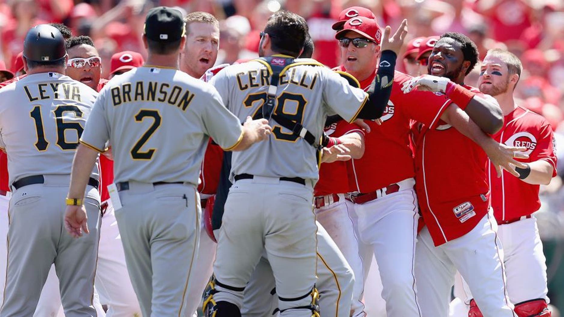 CINCINNATI, OH - AUGUST 02: Brandon Phillips #4 (far right) of the Cincinnati Reds is restrained by Manager Bryan Price after being hit by a pitch in the 8th inning against the Pittsburgh Pirates and benches emptied at Great American Ball Park on August 2, 2015 in Cincinnati, Ohio. (Photo by Andy Lyons/Getty Images)