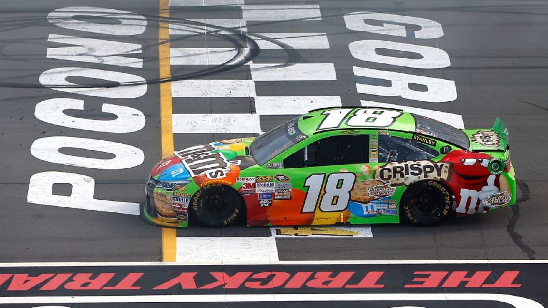 LONG POND, PA - AUGUST 02: Kyle Busch, driver of the #18 M&M's Crispy Toyota, is seen after running out of fuel in the closing laps of the NASCAR Sprint Cup Series Windows 10 400 at Pocono Raceway on August 2, 2015 in Long Pond, Pennsylvania. (Photo by Jonathan Ferrey/NASCAR via Getty Images)