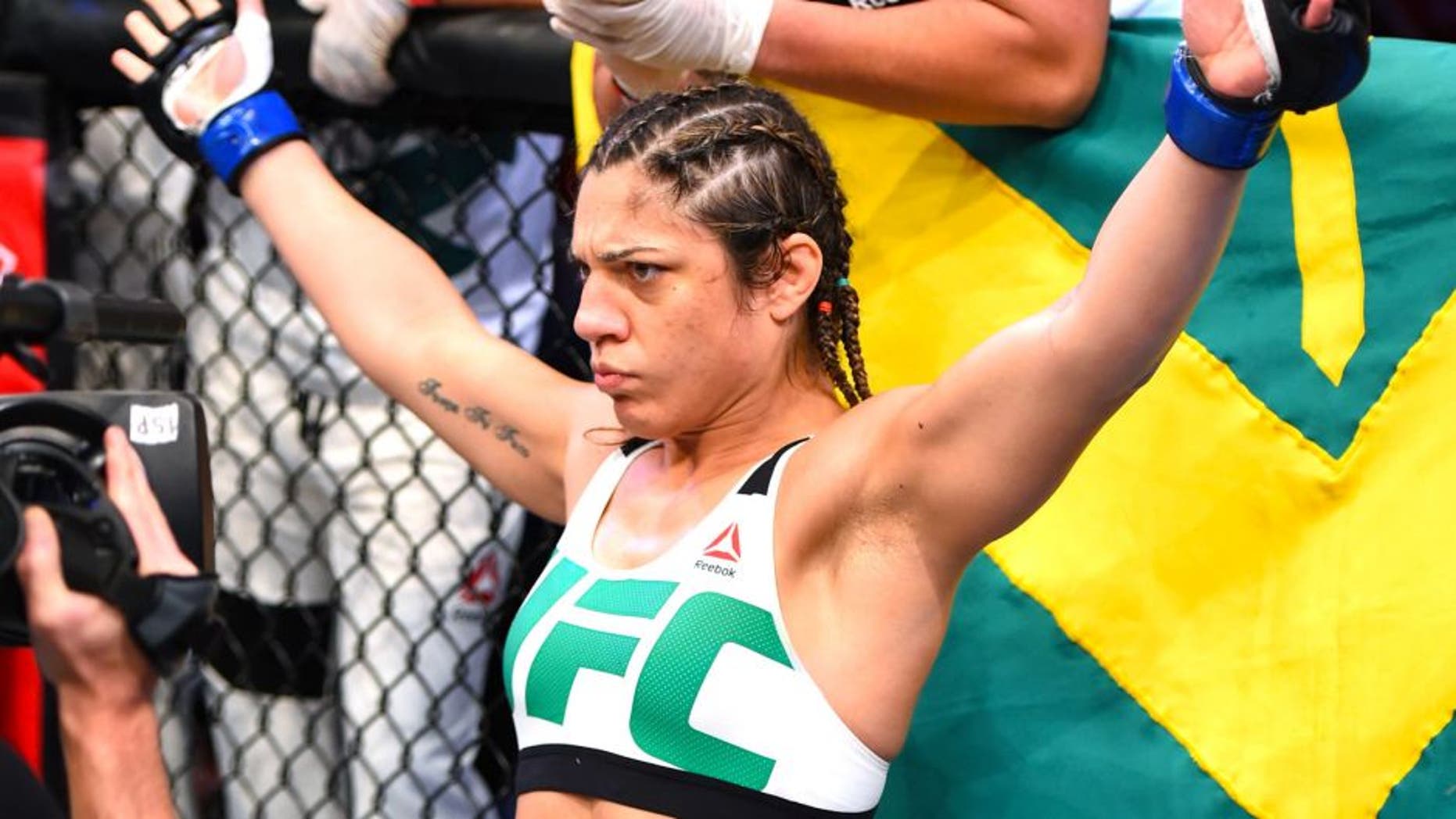 RIO DE JANEIRO, BRAZIL - AUGUST 01: Bethe Correia of Brazil enters the Octagon before facing Ronda Rousey of the United States in their UFC women's bantamweight championship bout during the UFC 190 event inside HSBC Arena on August 1, 2015 in Rio de Janeiro, Brazil. (Photo by Josh Hedges/Zuffa LLC/Zuffa LLC via Getty Images)
