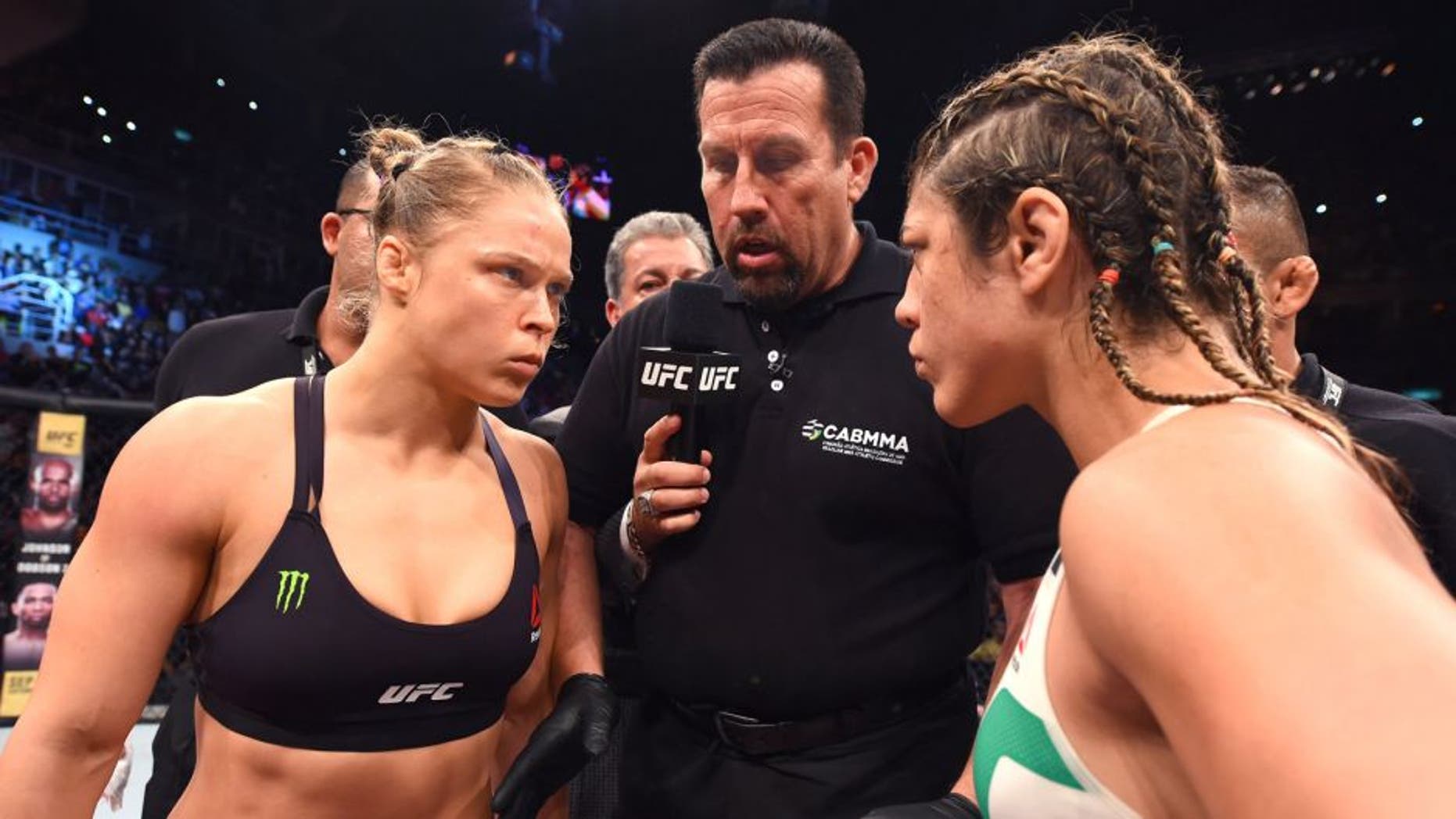 RIO DE JANEIRO, BRAZIL - AUGUST 01: UFC strawweight champion Ronda Rousey of the United States Bethe Correia of Brazil face off in their UFC women's bantamweight championship bout during the UFC 190 event inside HSBC Arena on August 1, 2015 in Rio de Janeiro, Brazil. (Photo by Josh Hedges/Zuffa LLC/Zuffa LLC via Getty Images)