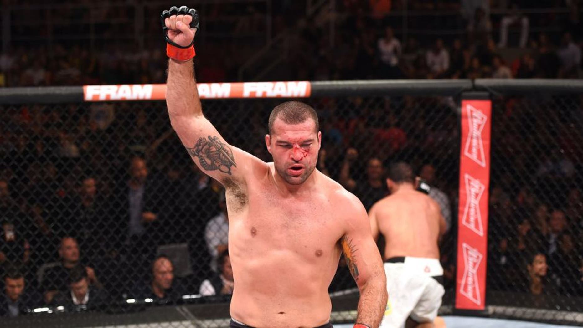 RIO DE JANEIRO, BRAZIL - AUGUST 01: (L-R) Mauricio 'Shogun' Rua of Brazil celebrates his victory over Rogerio Nogueira of Brazil in their light heavyweight bout during the UFC 190 event inside HSBC Arena on August 1, 2015 in Rio de Janeiro, Brazil. (Photo by Josh Hedges/Zuffa LLC/Zuffa LLC via Getty Images)