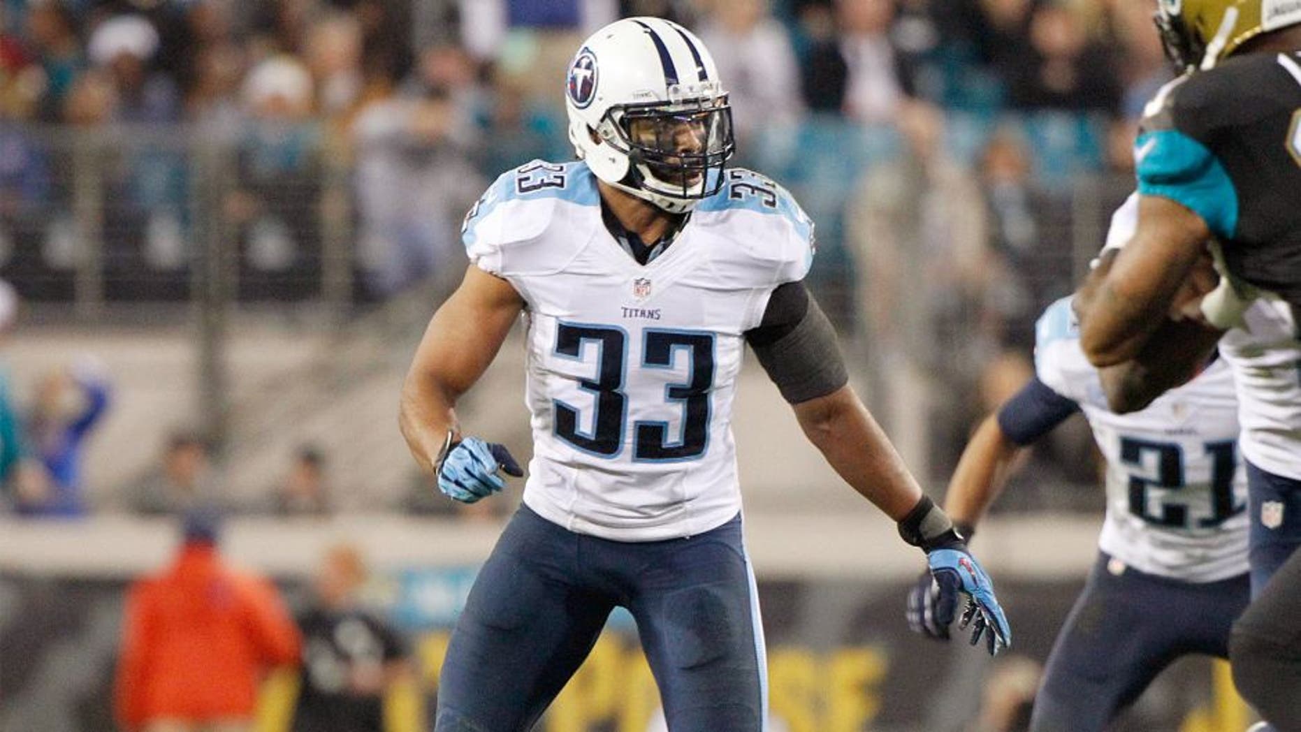 Dec 18, 2014; Jacksonville, FL, USA; Tennessee Titans free safety Michael Griffin (33) rushes against the Jacksonville Jaguars during the second half at EverBank Field. Jacksonville Jaguars defeated the Tennessee Titans 21-13. Mandatory Credit: Kim Klement-USA TODAY Sports