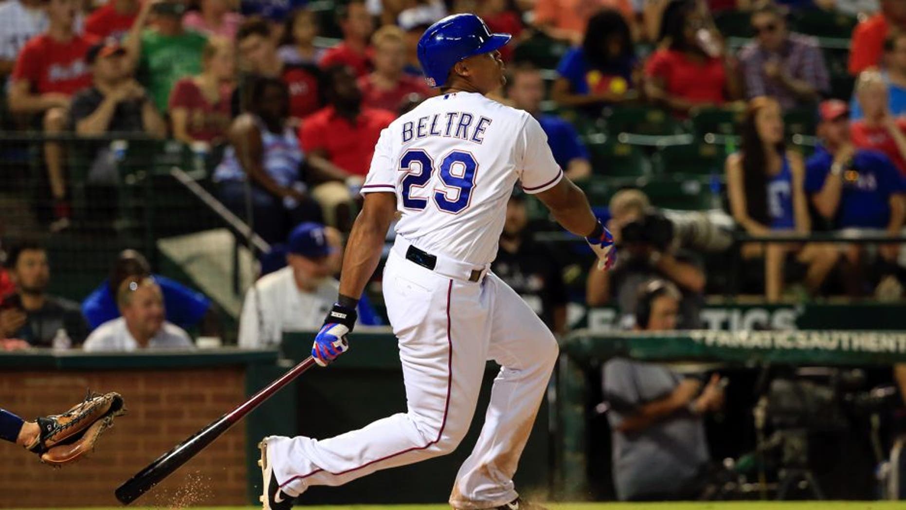 Aug 3, 2015; Arlington, TX, USA; Texas Rangers third baseman Adrian Beltre (29) hits a home run to complete the cycle during the fifth inning against the Houston Astros at Globe Life Park in Arlington. Mandatory Credit: Kevin Jairaj-USA TODAY Sports