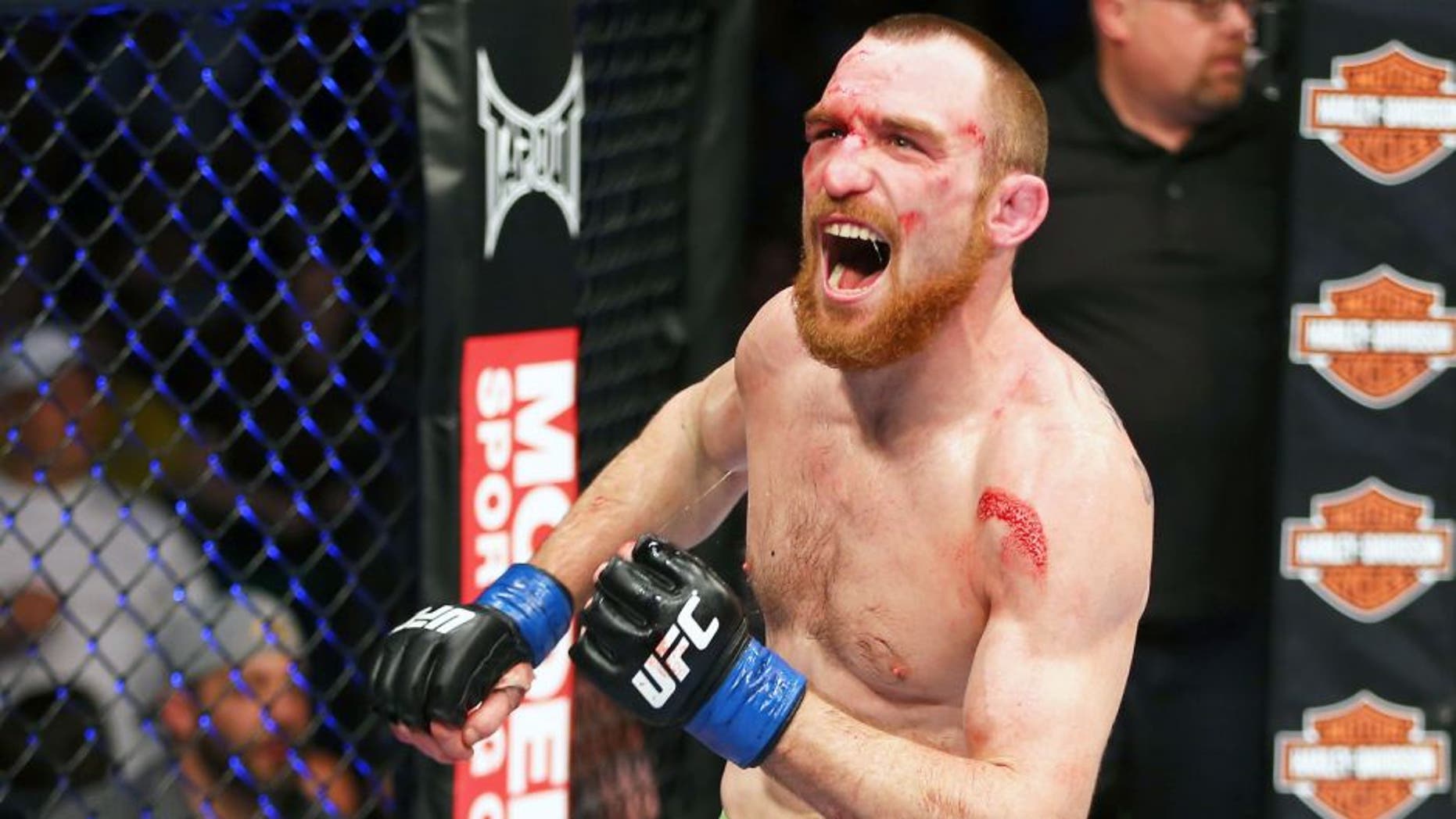 NEWARK, NJ - APRIL 27: Pat Healy celebrates defeating Jim Miller by Technical Submission (Rear-Naked Choke) in their lightweight bout during the UFC 159 event at the Prudential Center on April 27, 2013 in Newark, New Jersey. (Photo by Al Bello/Zuffa LLC/Zuffa LLC Via Getty Images)