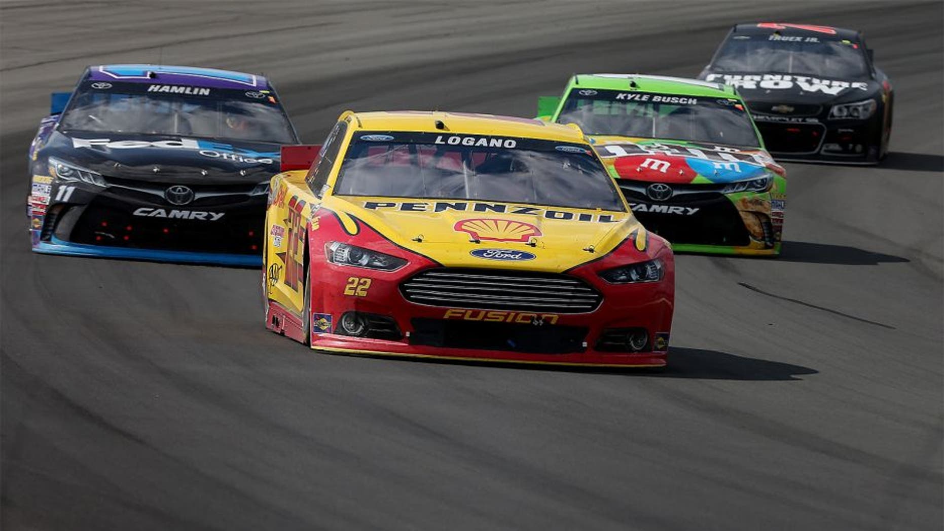 LONG POND, PA - AUGUST 02: Joey Logano, driver of the #22 Shell Pennzoil Ford, leads a pack of cars during the NASCAR Sprint Cup Series Windows 10 400 at Pocono Raceway on August 2, 2015 in Long Pond, Pennsylvania. (Photo by Nick Laham/Getty Images)