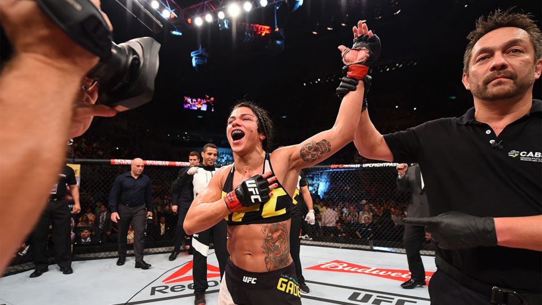 RIO DE JANEIRO, BRAZIL - AUGUST 01: Claudia Gadelha of Brazil celebrates her victory over Jessica Aguilar of the United States in their women's strawweight bout during the UFC 190 event inside HSBC Arena on August 1, 2015 in Rio de Janeiro, Brazil. (Photo by Josh Hedges/Zuffa LLC/Zuffa LLC via Getty Images)