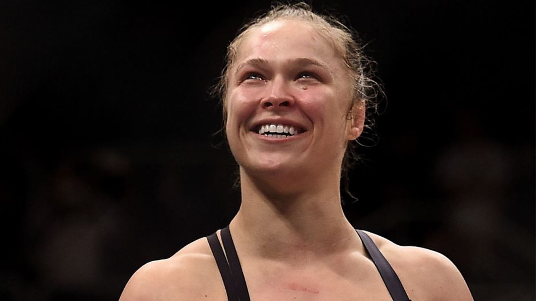 RIO DE JANEIRO, BRAZIL - AUGUST 01: Ronda Rousey of the United States celebrates victory over Bethe Correia of Brazil in their bantamweight title fight during the UFC 190 Rousey v Correia at HSBC Arena on August 1, 2015 in Rio de Janeiro, Brazil. (Photo by Buda Mendes/Zuffa LLC/Zuffa LLC via Getty Images)
