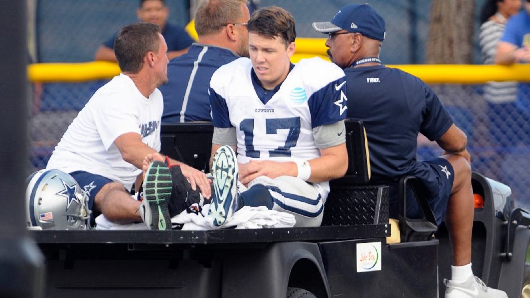 Dallas Cowboys quarterback Kellen Moore (17) is carted off the field after an ankle injury during the afternoon practice at the team's training camp in Oxnard, Calif., n Tuesday, Aug. 2, 2016. (Max Faulkner/Fort Worth Star-Telegram/TNS via Getty Images)