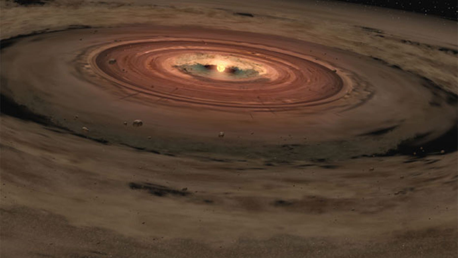 This artist's illustration shows a very young star surrounded by a disk of gas and dust, the raw materials from which rocky planets such as Earth form.