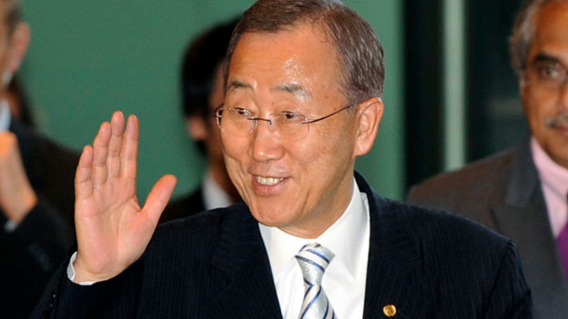 Aug. 4: U.N. Secretary-General Ban Ki-moon waves to reporters in Tokyo. A former American prosecutor has accused Ban of hiring discrimination based on gender and nationality.