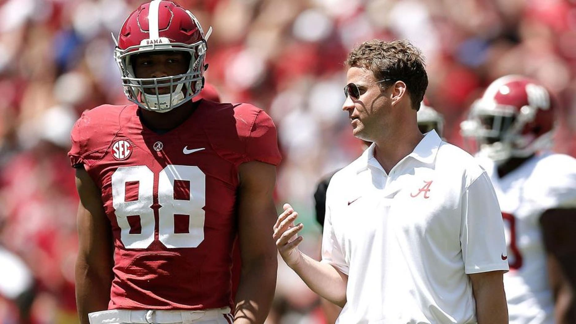 TUSCALOOSA, AL - APRIL 19: Offensive coordinator Lane Kiffin of the Alabama Crimson Tide speaks with O.J. Howard #88 of the Crimson team during the University of Alabama A-Day spring game at Bryant-Denny Stadium on April 19, 2014 in Tuscaloosa, Alabama. (Photo by Stacy Revere/Getty Images)