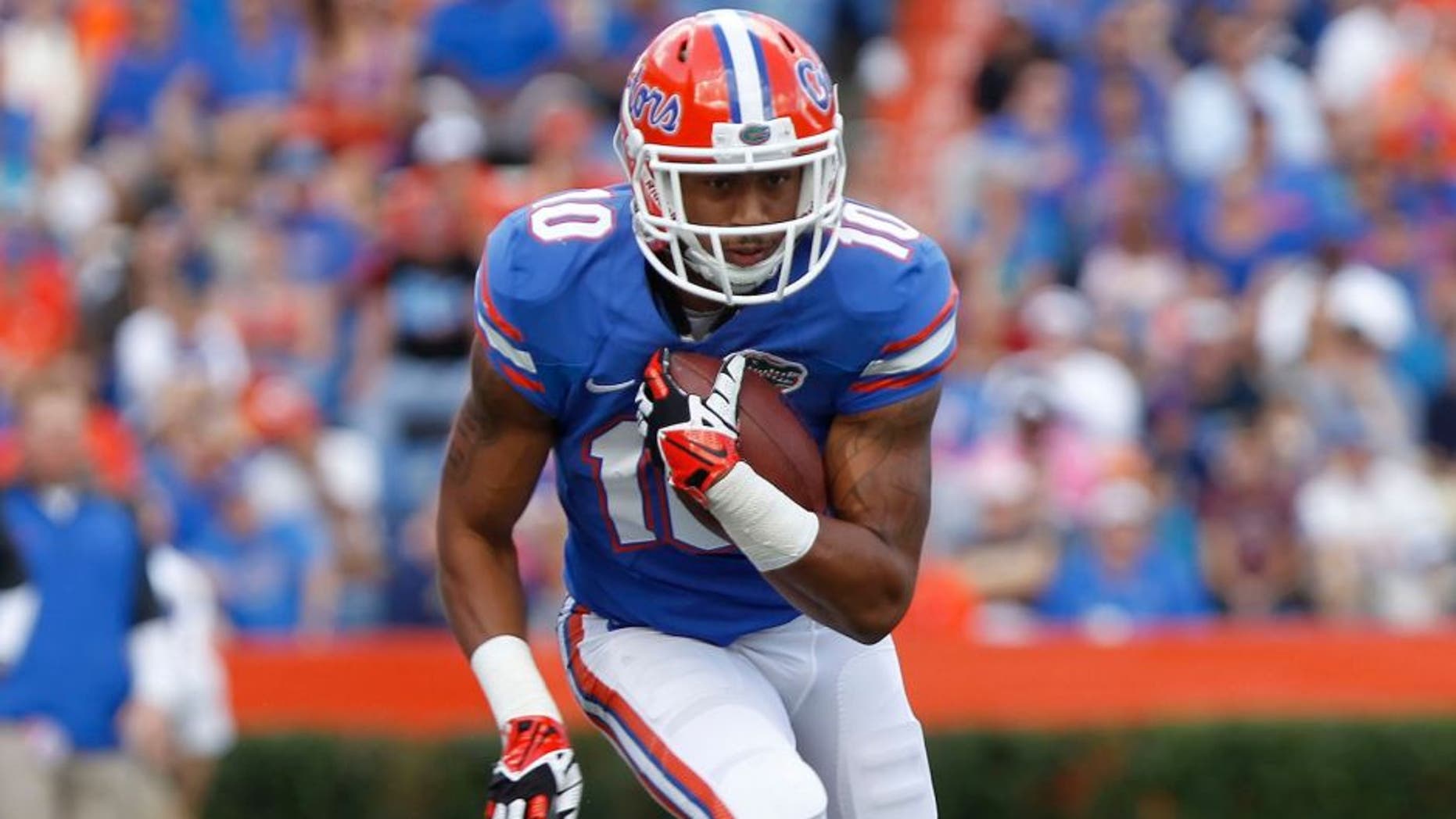 Nov 23, 2013; Gainesville, FL, USA; Florida Gators running back Valdez Showers (10) runs with the ball against the Georgia Southern Eagles during the first quarter at Ben Hill Griffin Stadium. Mandatory Credit: Kim Klement-USA TODAY Sports